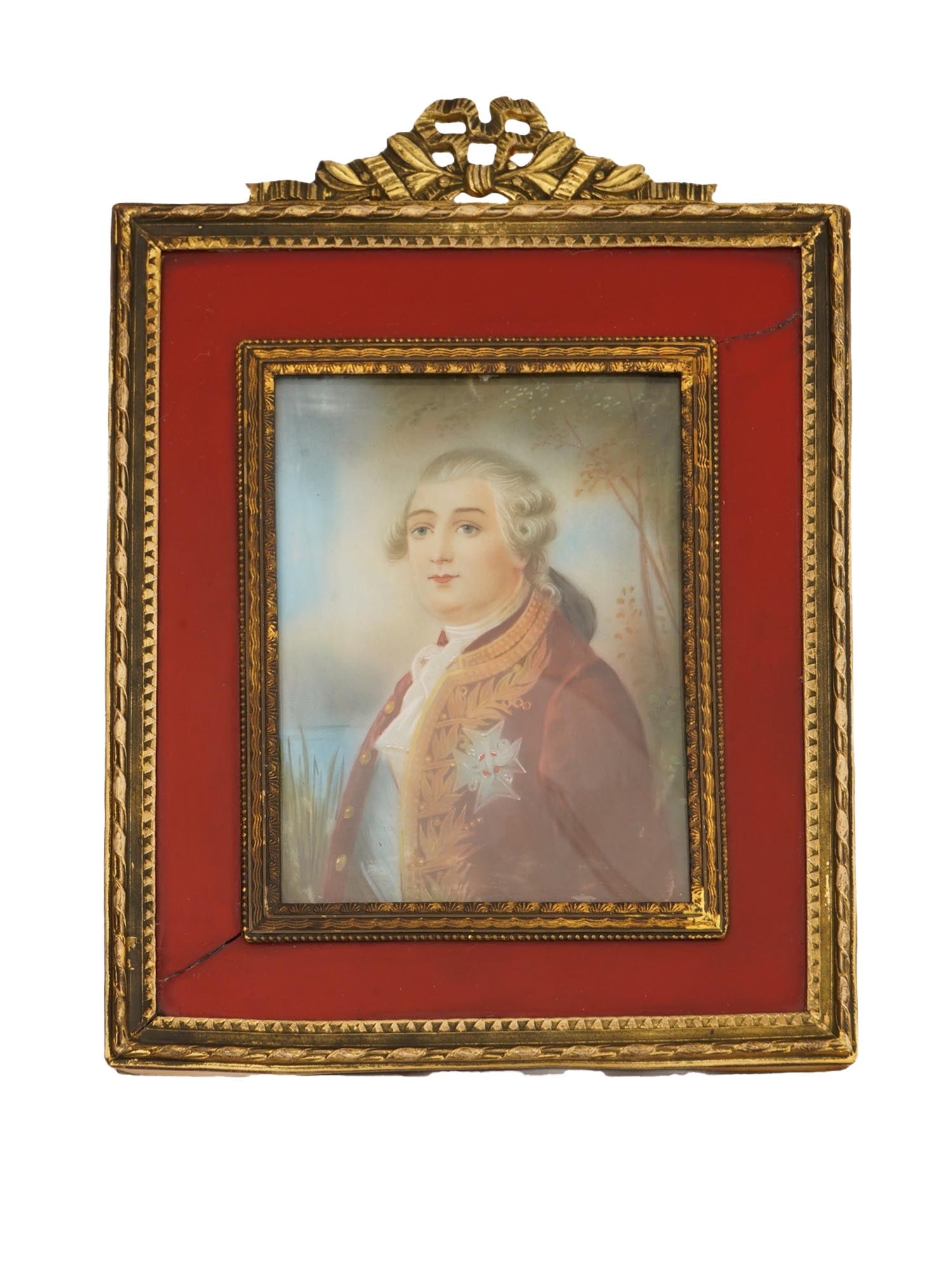 ANTIQUE MINIATURE PAINTING WITH GERMAN FRAME: An antique German classicistic picture frame with a miniature hand painted portrait painting. The picture frame with a double gold-tone geometric pattern topped with a bow-shaped ribbon decoration at