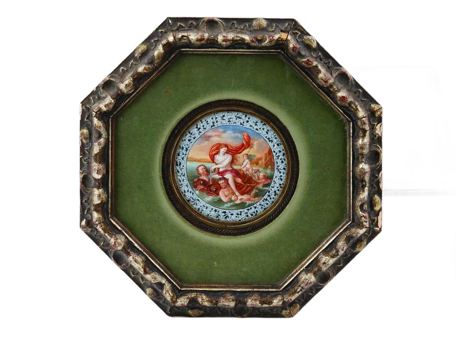 ANTIQUE ENAMEL ROUNDEL WITH A MYTHOLOGICAL SCENE: An antique enamel roundel, showcasing a hand-painted mythological scene rendered in the neoclassical style. The roundel is elegantly presented within an octagonal frame, accented by a rich green