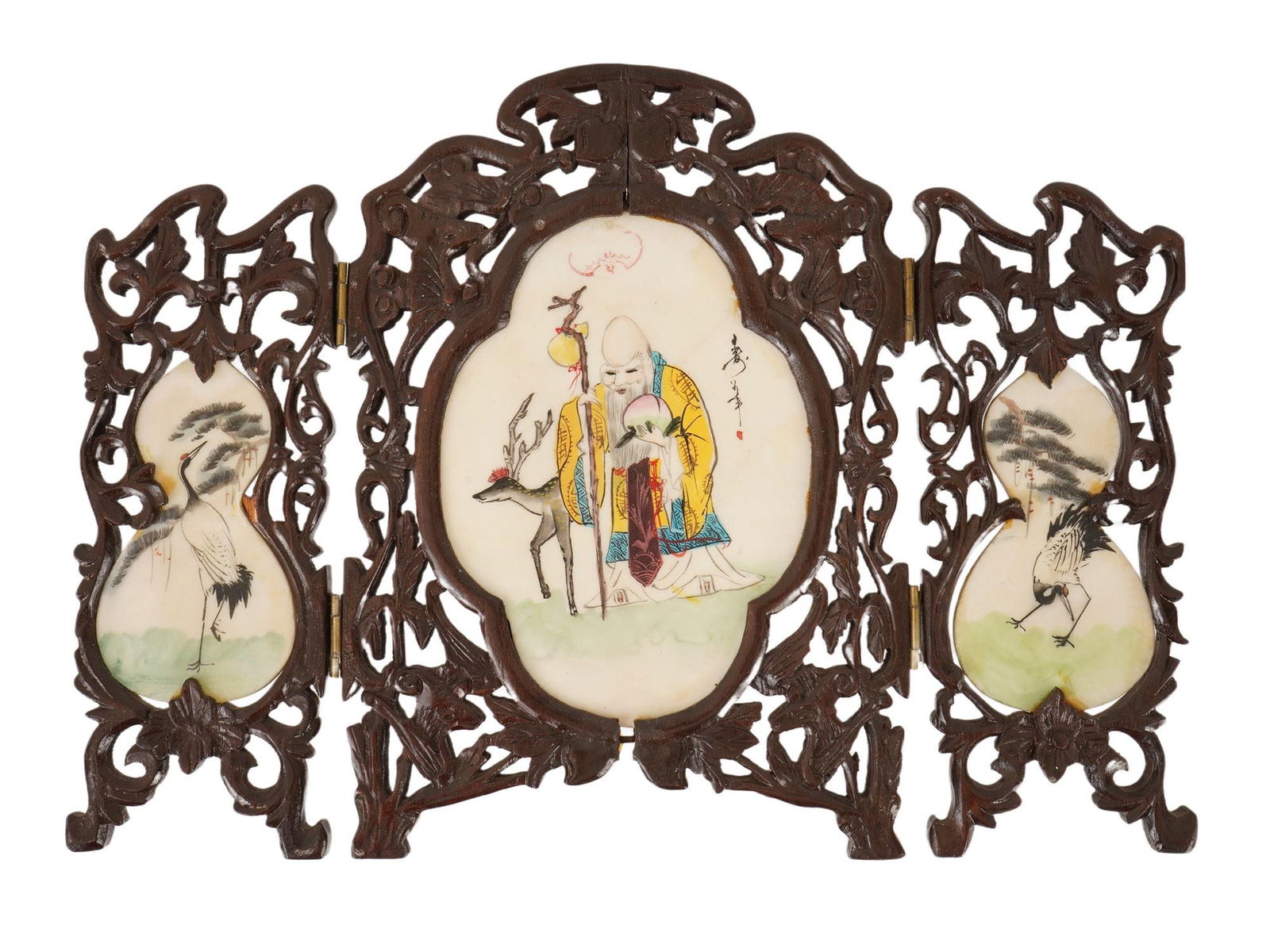 ANTIQUE CHINESE HAND PAINTED STONE AND WOOD TABLE SCREEN: An antique Chinese three-panel folding table screen, circa the 19th or early 20th-century. Combines intricate openwork wood carving with hand-painted stone inserts. The central panel features Shoulao,
