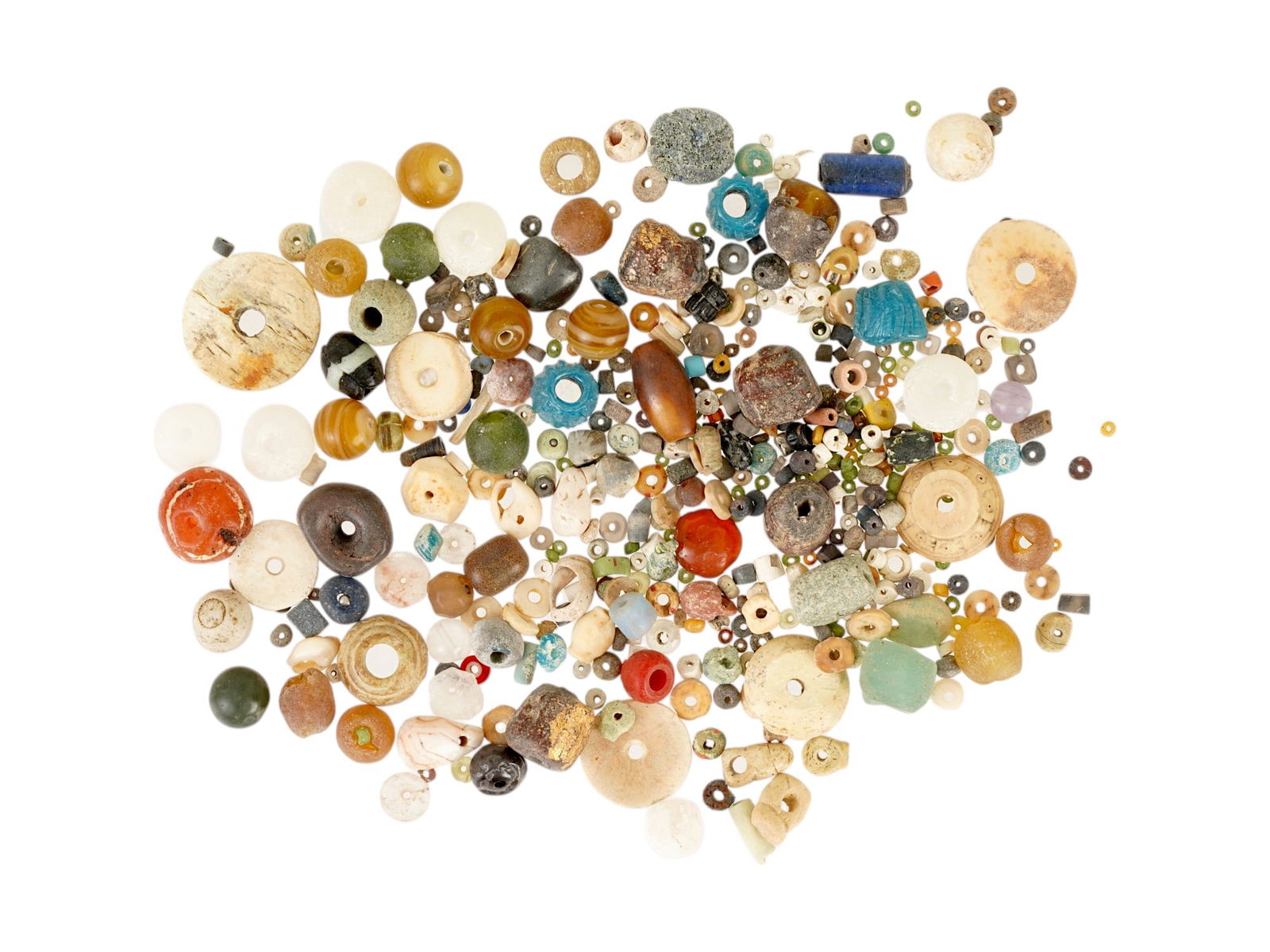 ANCIENT HOLY LAND GLASS FAIENCE STONE BEADS CA 500 BC: A collection of ancient Holy land area beads made of glass, carnelian, faience and other materials. This extensive assortment showcases the artistic diversity and craftsmanship of ancient cultures, wi