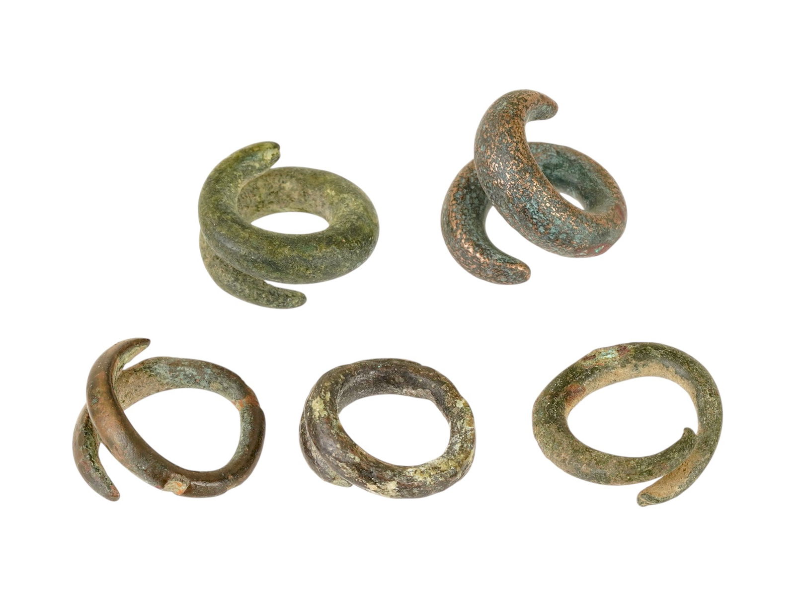 ANCIENT EGYPT BRONZE HAIR BANDS 2ND TO 1ST MILLENIUM BC: A group of ancient Egyptian bronze hair bands. Each ware is made in a swirl probably a snake design. Dating from the 2nd to 1st Millennium BC. Ancient Egyptian Silver and Bronze Jewelry Wares and Acce