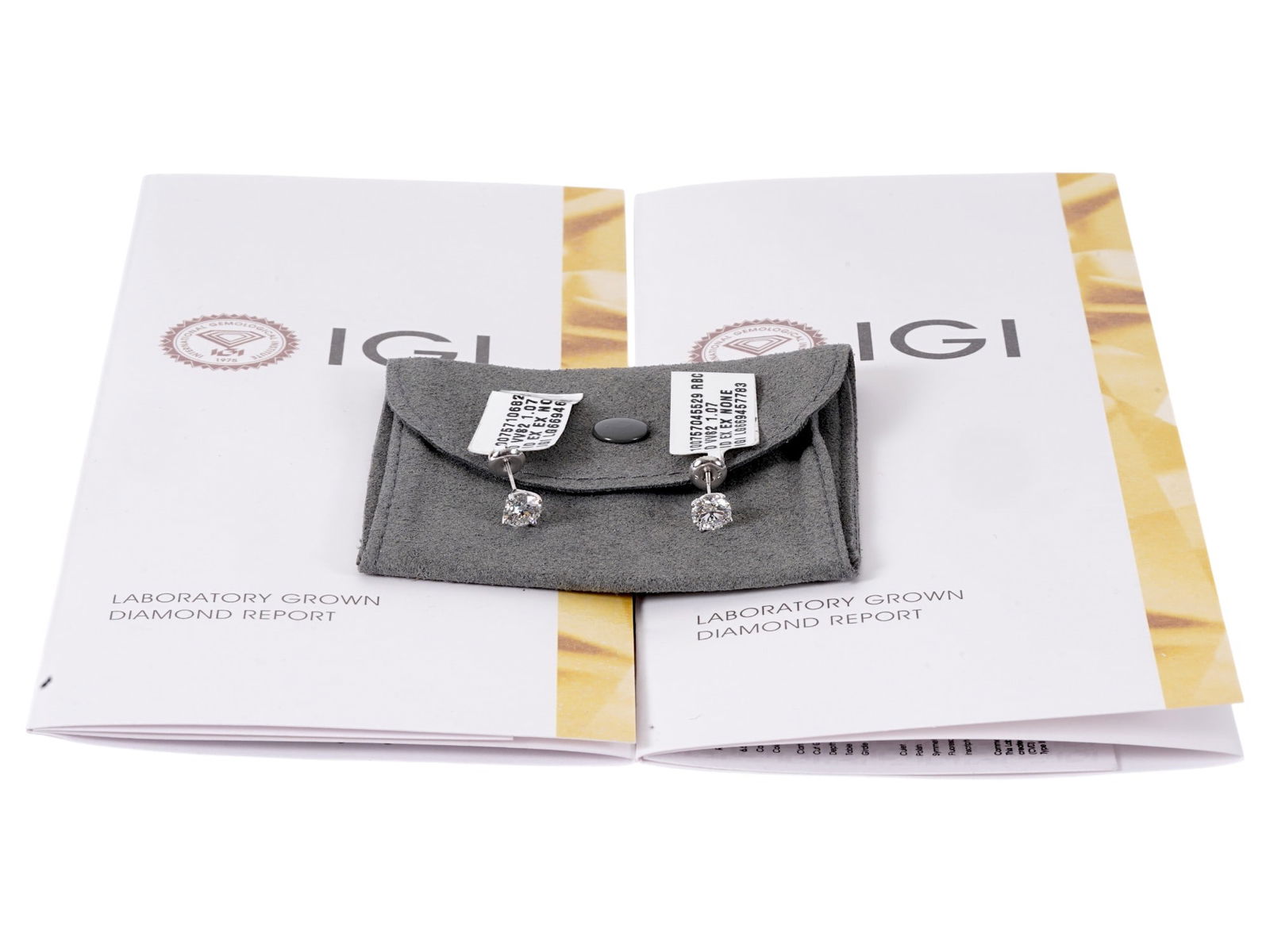 14K WHITE GOLD 2 CARAT LAB GROWN DIAMOND EARRINGS: This lot features a pair of classic lab-grown diamond stud earrings set in polished 14K white gold. The stones boast a combined total weight of 2.14 carats with a VVS2 D Grade, offering excellent bril