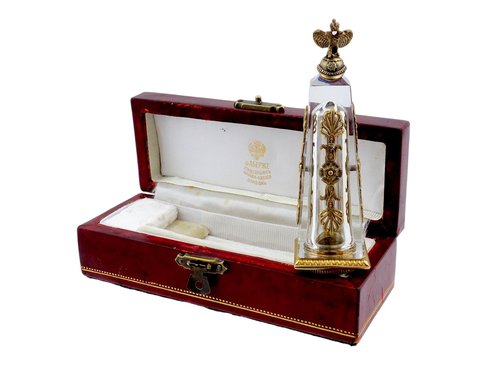 SILVER AND ROCK CRYSTAL COIN STAMP SEAL WITH EAGLE: A silver and rock crystal coin stamp seal with eagle. The seal is crafted from a single piece of rock crystal in an elegant tapering obelisk form. It is surmounted by a highly detailed gilt-silver sur