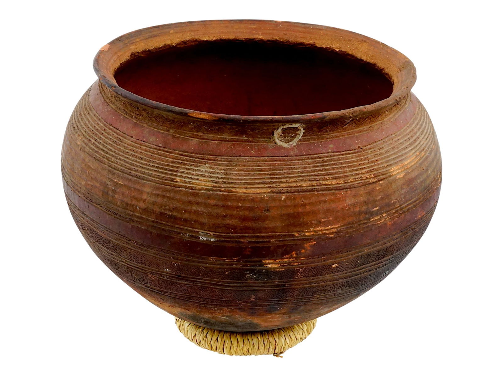 WEST AFRICAN TERRACOTTA POTTERY BIDA WATER VESSEL: A West African terracotta pottery Bida water vessel probably made by the Nupe people of Nigeria. The vessel is decorated with distinctive carved geometric patterns and stripes on the shoulders and