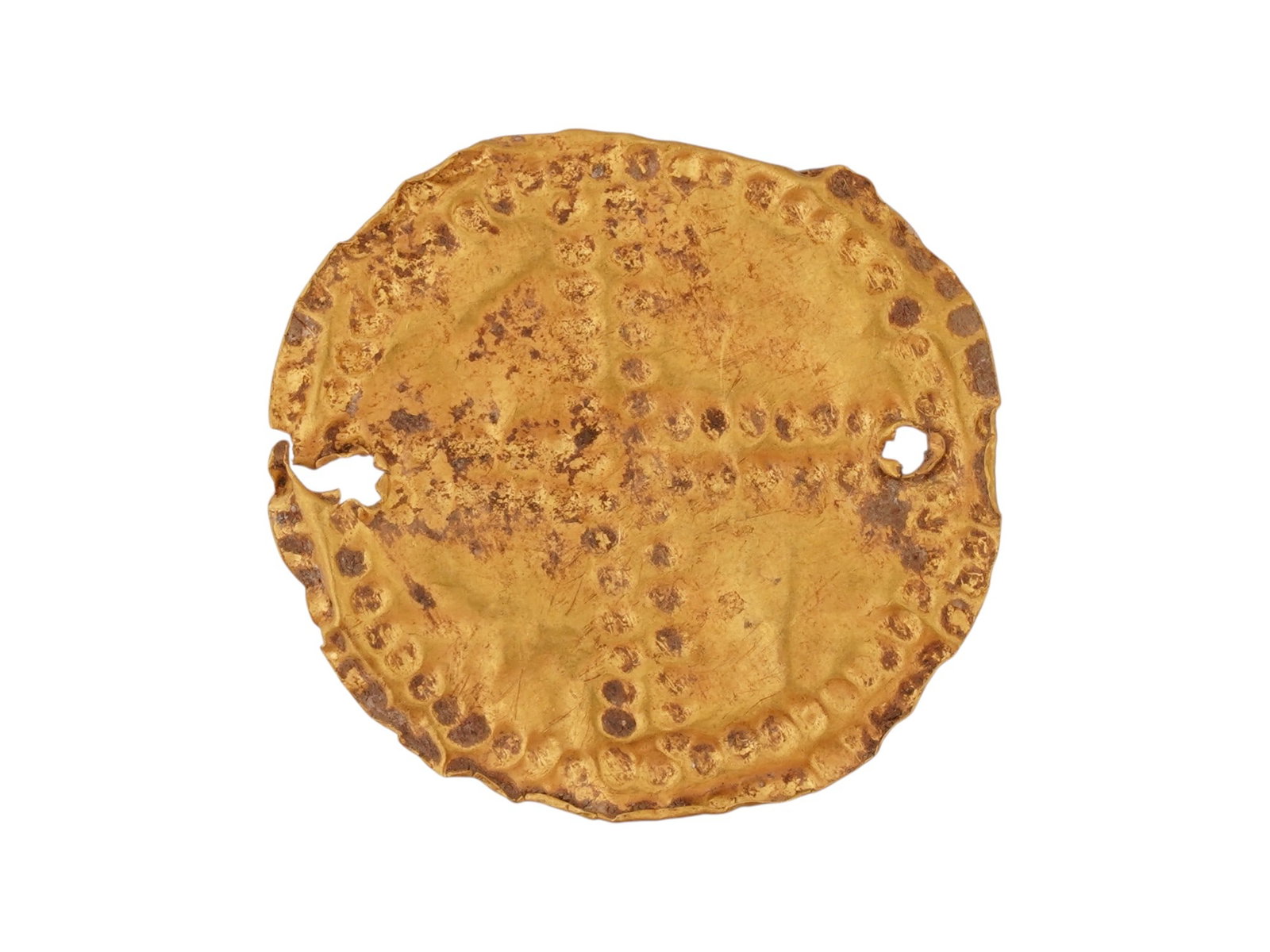 ANCIENT GREEK GOLD PLAQUE CIRCA 600 BC: An ancient Greek gold plaque featuring an embossed cross like dotted pattern. Circa: 600 BC. There are two through holes on the sides for attaching to clothing. Ancient Gold Roman Jewelry Wares and Ac
