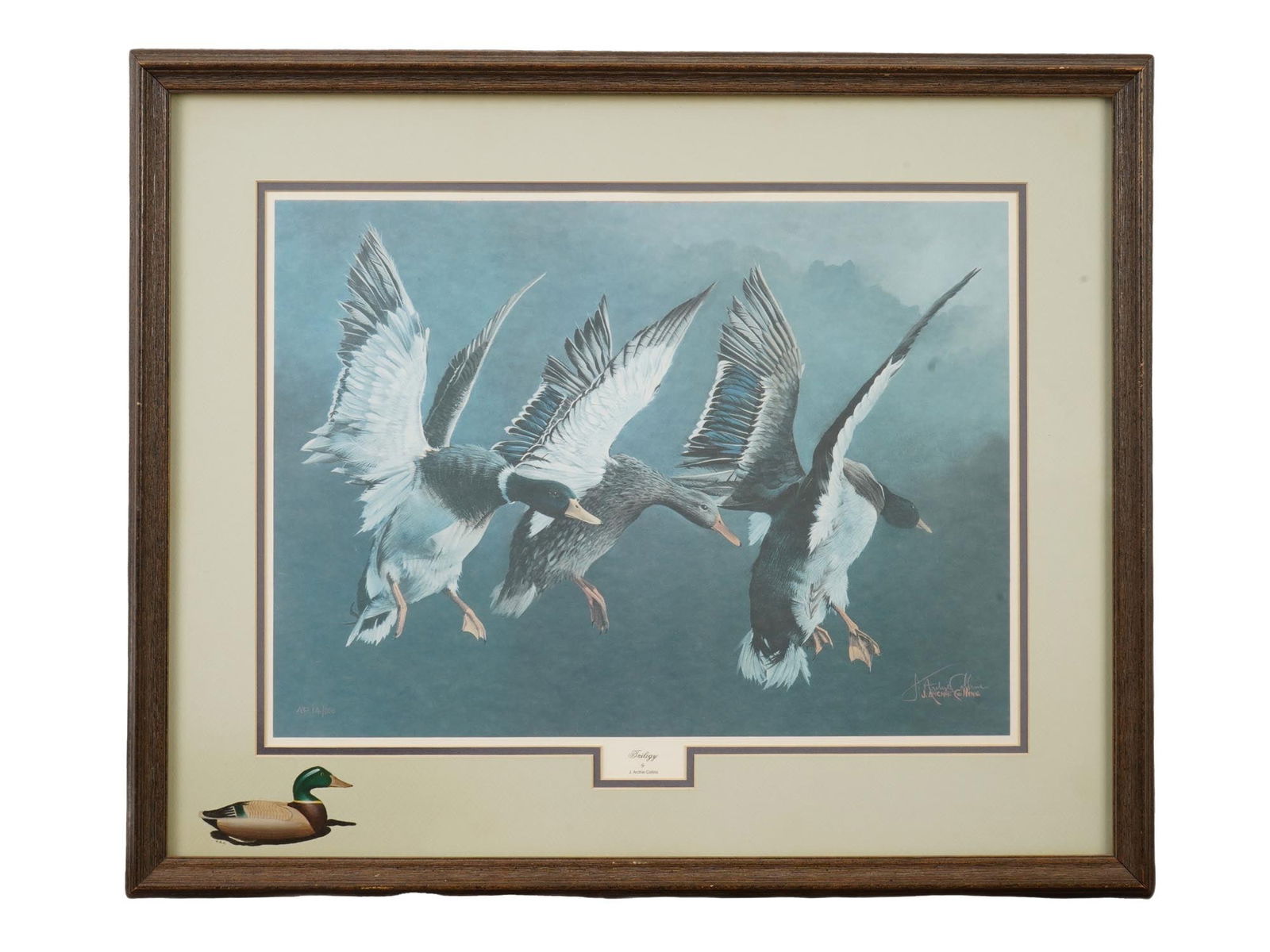 OFFSET LITHOGRAPH PRINT TRILOGY BY J. ARCHIE COLLINS: An offset lithograph print titled Trilogy by J. Archie Collins. The composition depicts blue geese descending through heavy mist. The print bears the artist’s signature in the lower right. Framed.