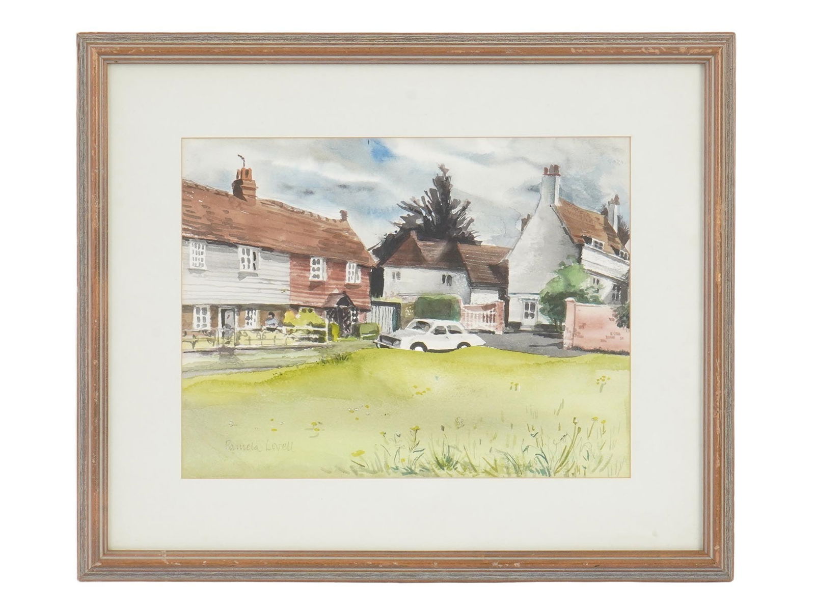 SIGNED PAMELA LAVELL AMERICAN WATERCOLOR PAINTING: A vintage American watercolor on paper painting signed Pamela Lavell. The artwork depicts a landscape with houses and a white car in the countryside. Signed lower left. Matted and framed. Watercolor F