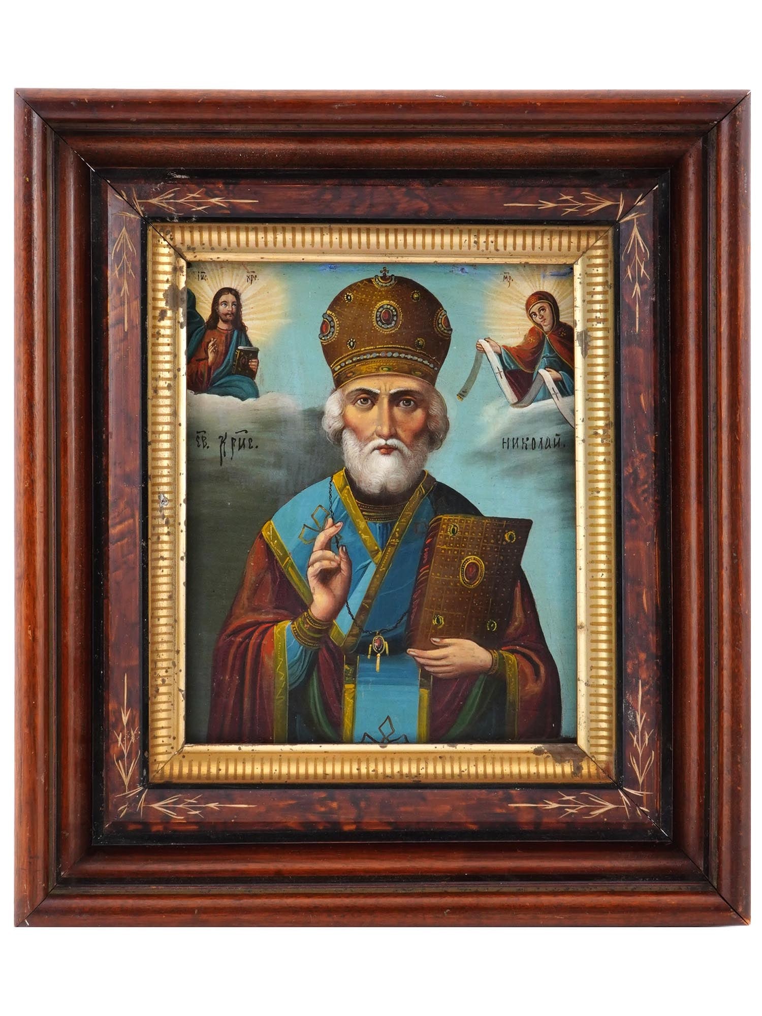 ANTIQUE RUSSIAN ICON OF SAINT NICHOLAS OF MYRA: An antique 19th-century Russian Orthodox icon representing Saint Nicholas of Myra, also known as the Wonderworker, with the blessing figures of Virgin Mary and Jesus Christ. Mixed media painting: egg