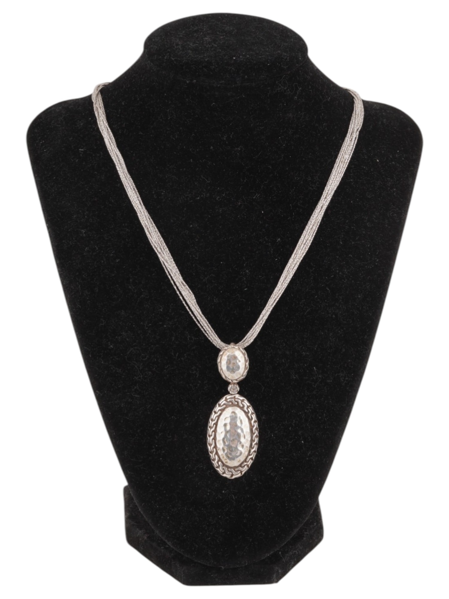 STERLING SILVER HAND HAMMERED MULTI CHAIN NECKLACE: A vintage Italian sterling silver hand hammered multi chain pendant necklace. The elegant necklace with a multi-strand chain and a hand-hammered double oval pendant in a modernist design. Marked with