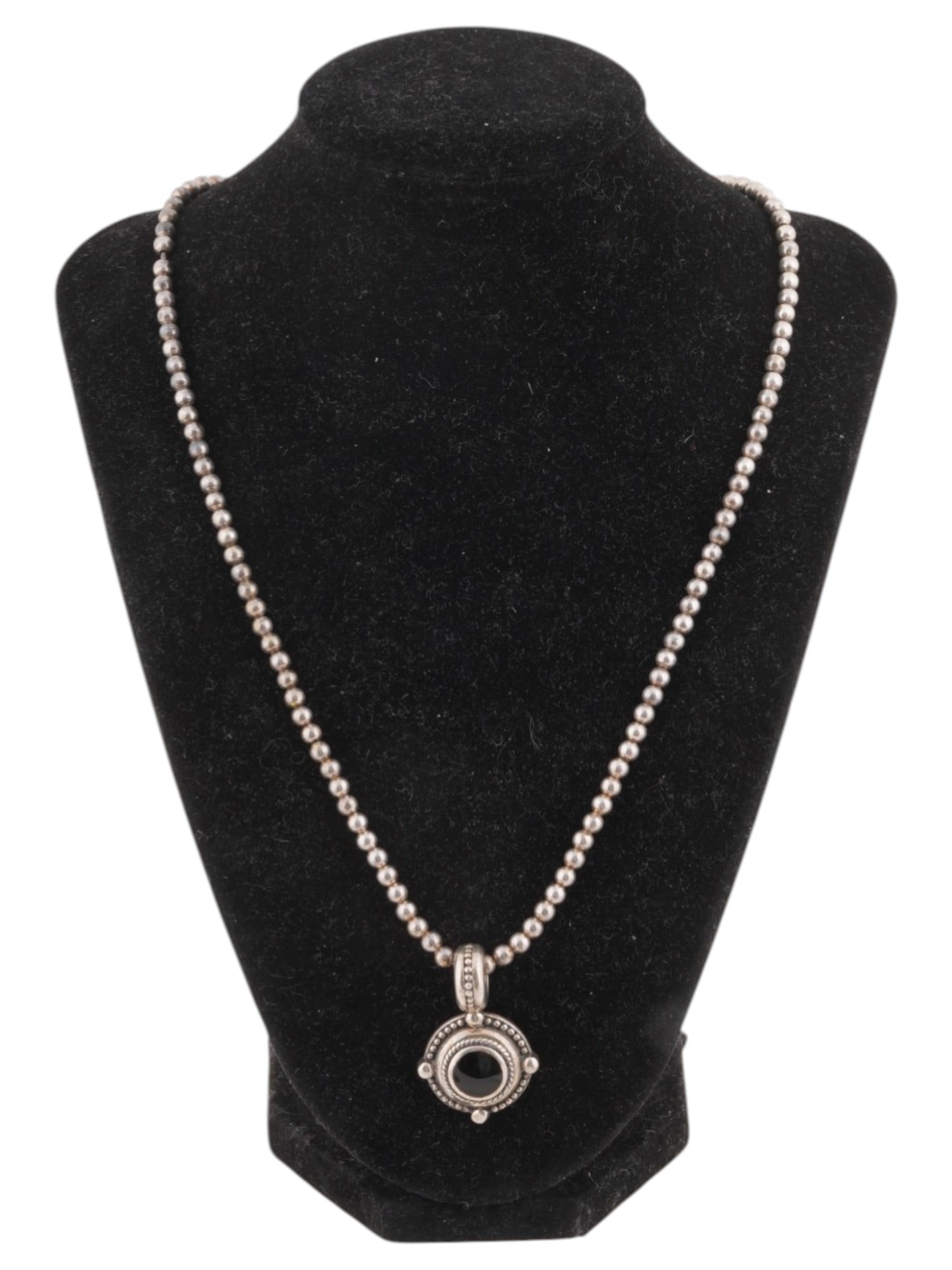 VTG STERLING SILVER BEAD NECKLACE BLACK JASPER PENDANT: A vintage sterling silver bead necklace featuring a circular pendant set with a polished black jasper stone. The pendant is framed by rope-style detailing. Suspended from a classic sterling silver bea