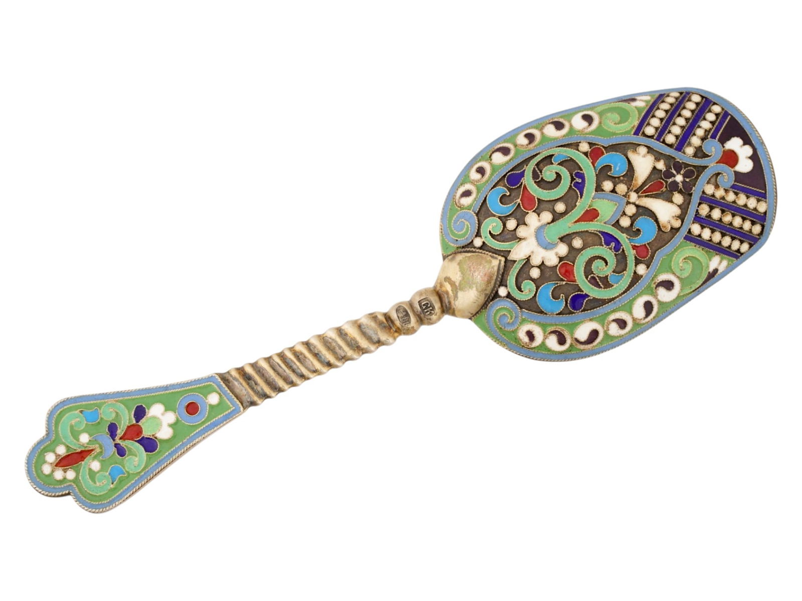 ANTIQUE RUSSIAN SILVER CLOISONNE ENAMEL SUGAR SPOON: An antique Russian silver sugar spoon featuring a distinctive shovel-shaped bowl with a twisted stem. Crafted in the traditional Russian style, the piece showcases colorful scrolling foliate enamel wo