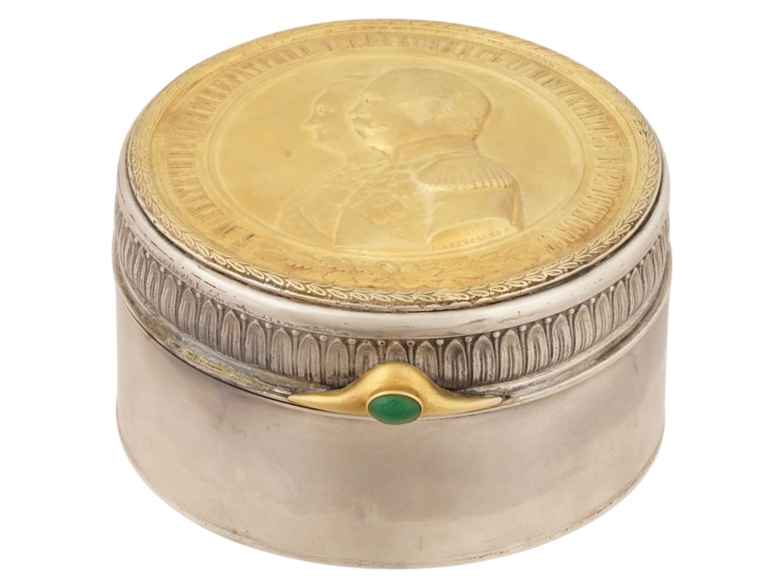 RUSSIAN SILVER IMPERIAL PRESENTATION ROUND BOX W EMERALD: A Russian Imperial Silver presentation box. The round shaped box is adorned with a mounted medal issued in honor of the 100th anniversary of the Military Order of the Holy Great Martyr and Victorious