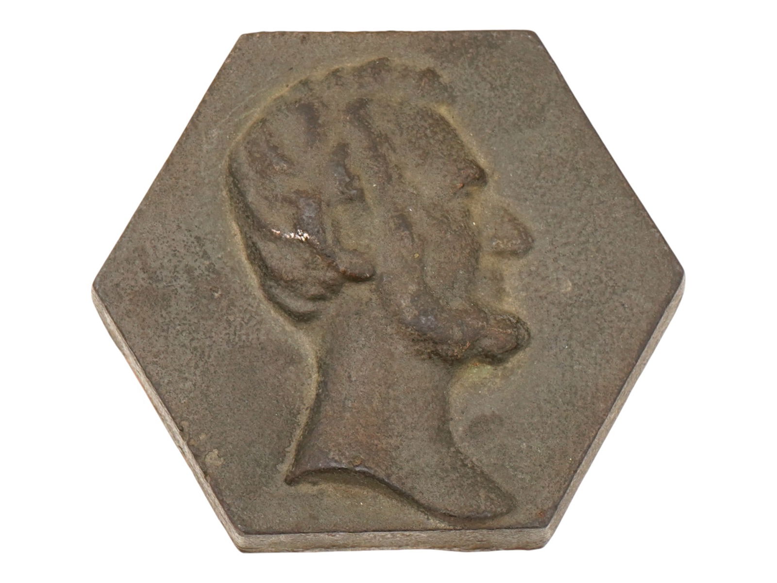 ANTIQUE AMERICAN CAST IRON LINCOLN PAPERWEIGHT: An antique American cast iron Lincoln paperweight. Hexagonal paperweight with a bust portrait of President Abraham Lincoln in the right profile. Collectible US Metalwork, Home Decor For Interior Desig