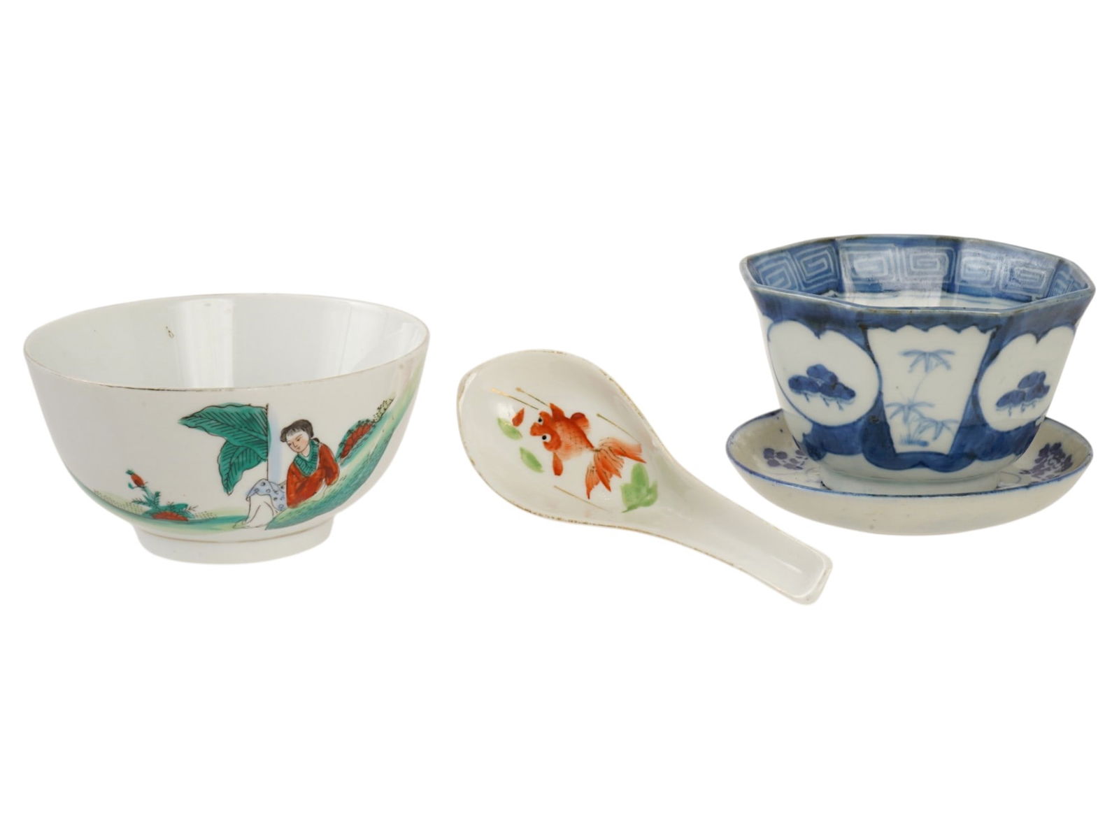 GROUP OF FOUR ASIAN PORCELAIN WARES: A group of four Asian porcelain wares features a polychrome figural bowl hand painted with a lady, a traditional porcelain soup spoon hand-painted with a goldfish motif, an octagonal blue and white bl