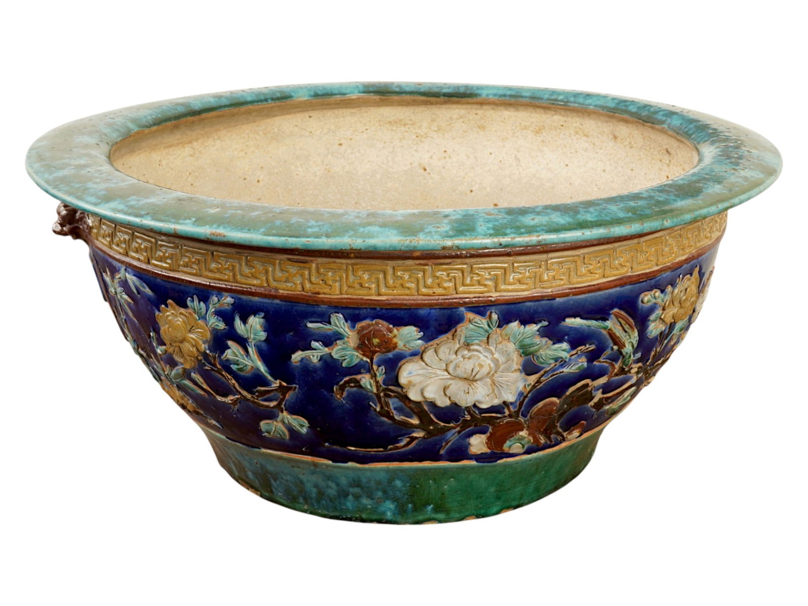 IMPORTANT ANTIQUE CHINESE QING FLORAL CERAMIC POT: An important antique Chinese Qing dynasty ceramic pot. The exterior is richly adorned with a deep cobalt-blue ground, featuring a continuous frieze of blossoming peonies, gnarled branches and immortal