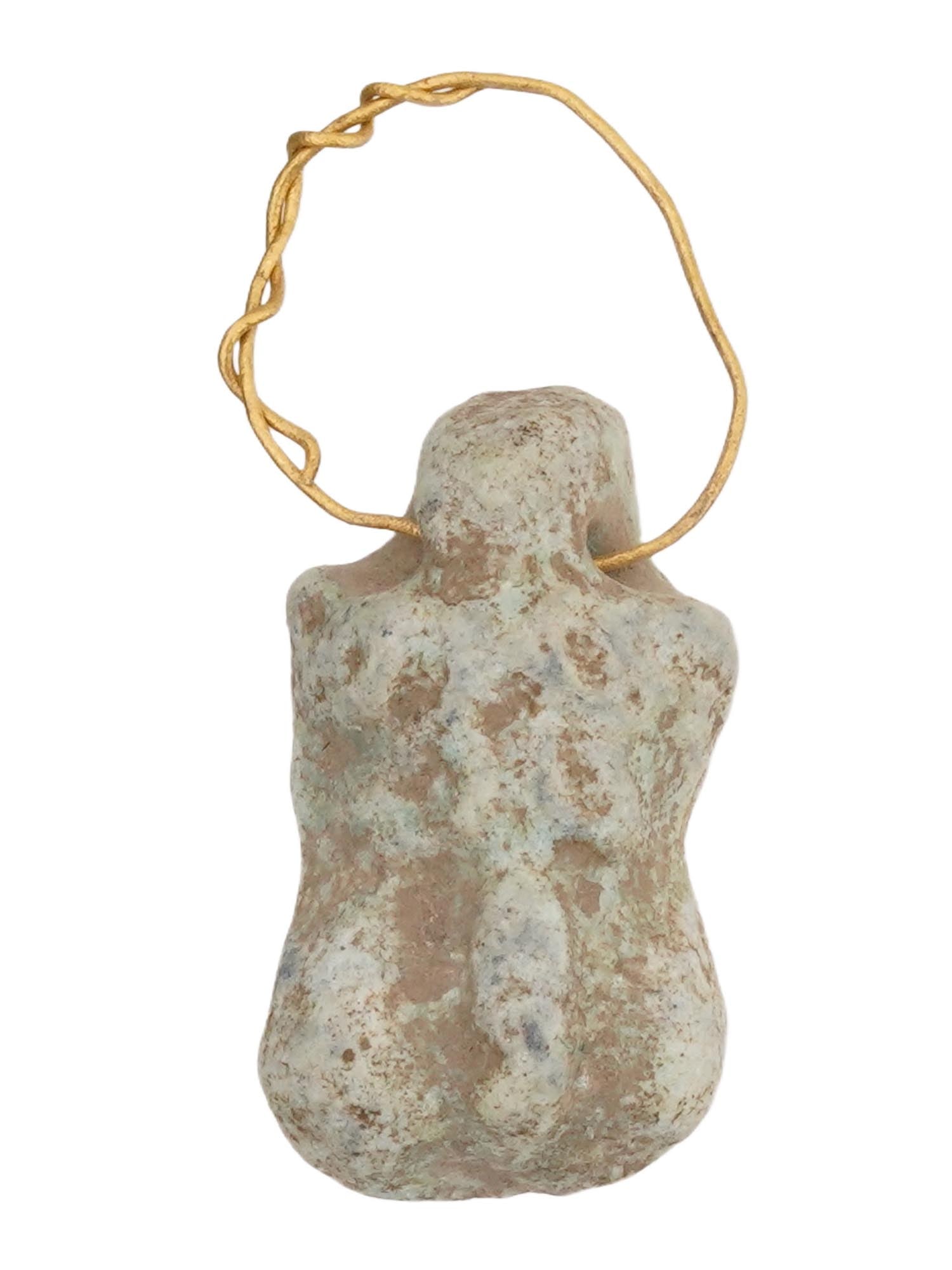 ANCIENT EGYPTIAN LATE PERIOD EROTIC PENDANT W GOLD: An ancient Egyptian Late Period, ca. 700 to 200 BC, faience figural pendant. The pendant represents an erotic figure,the body fragment crafted with detailed patterns. An opening for wearing with twist