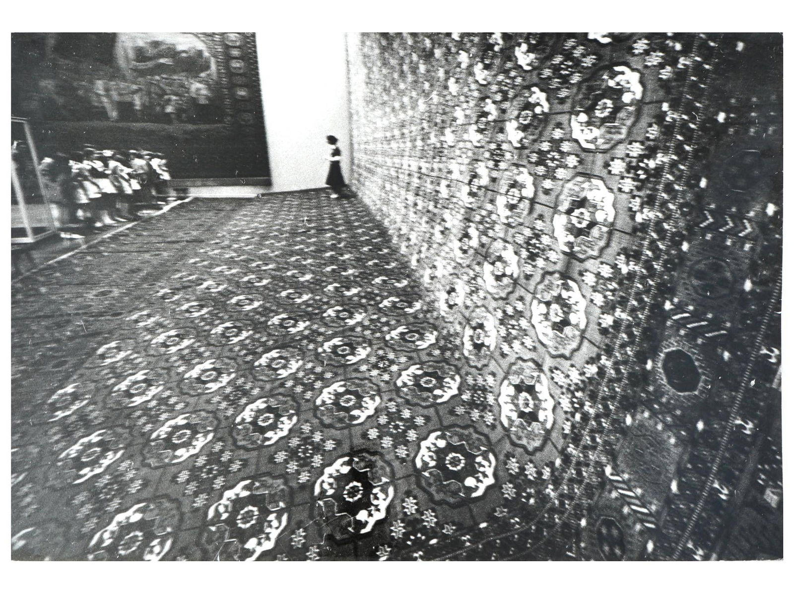 RUSSIAN SOVIET ERA PHOTOGRAPH BY GEORGY ZELMA: A black-and-white photograph by Georgy Zelma, 1906 to 1984, a Soviet photographer and photojournalist. The piece depicts a large oriental carpet on museum display. Artists stamp and pencil marks on th