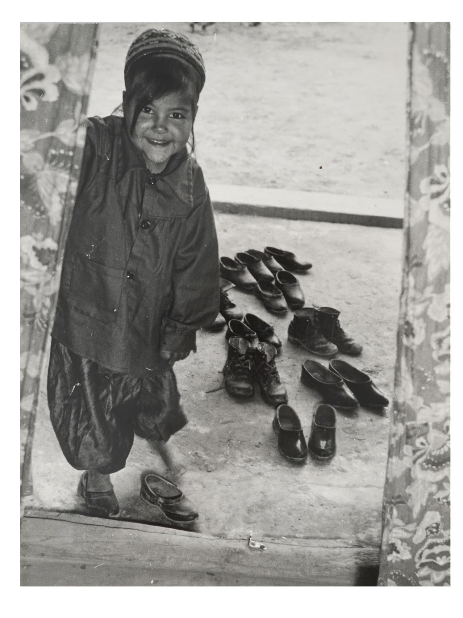 RUSSIAN SOVIET GEORGY ZELMA PORTRAIT PHOTOGRAPH: A vintage Russian Soviet Portrait photograph by Georgy Zelma. The fine photo depicts the portrait of a little Central Asian girl. Stamped with the name of the artist and date 1984 on the back side. Si