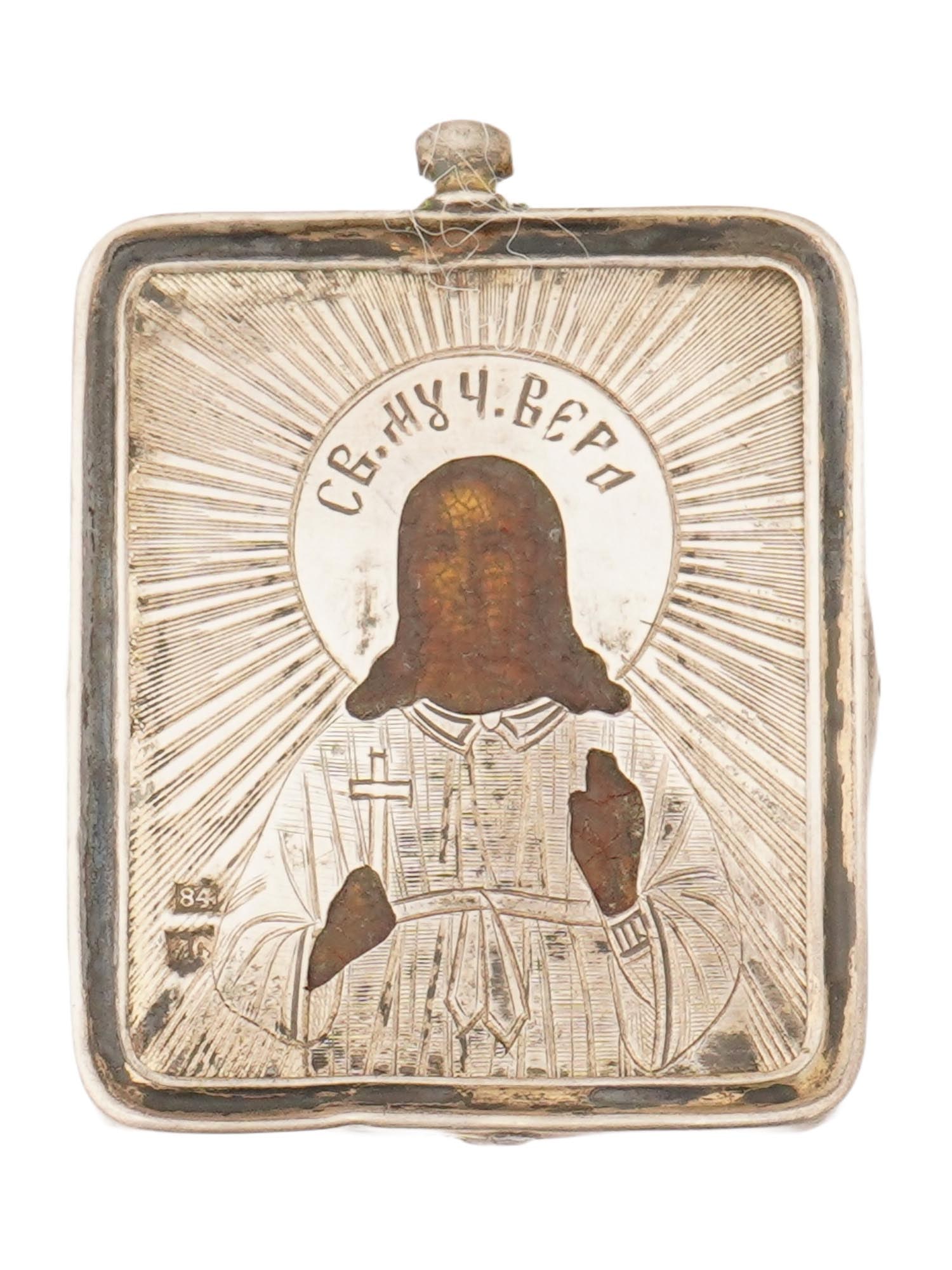 ANTIQUE RUSSIAN ICON PENDANT CHRIST THE TEACHER W OKLAD: An antique Russian traveling icon pendant depicting Christ the Teacher, a traditional Orthodox representation of Christ as Ruler of All. The icon shows Christ with his right hand raised in a gesture o