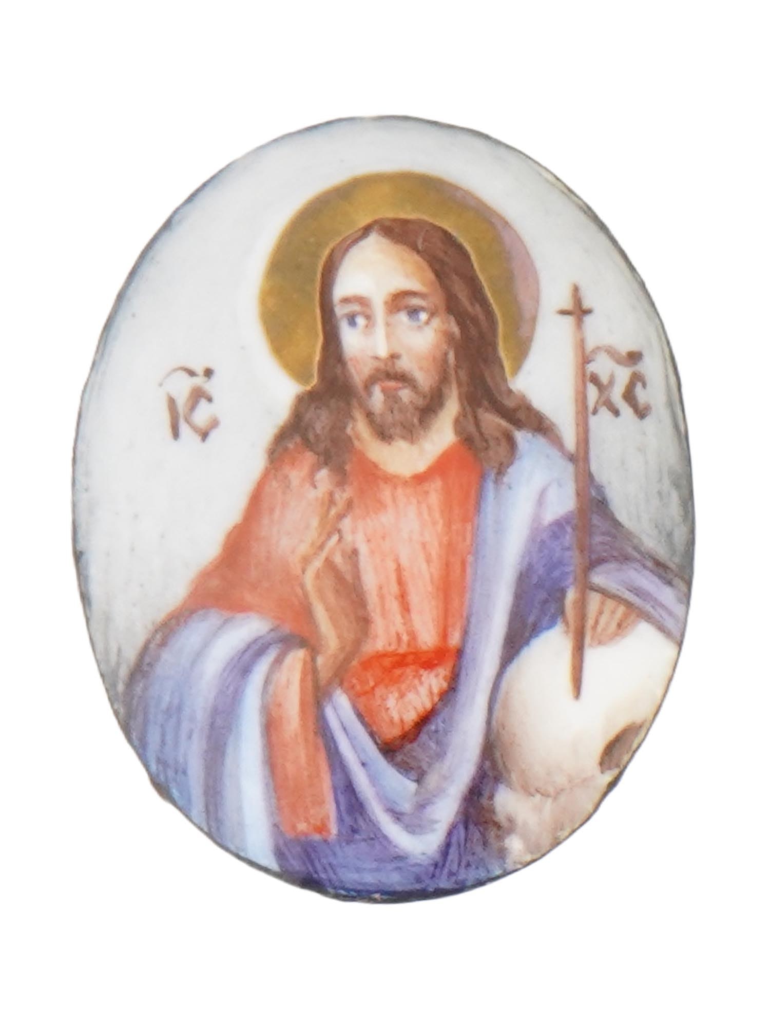 ANTIQUE RUSSIAN ORTHODOX FINIFT ICON OF JESUS CHRIST: An antique Russian Orthodox finift icon of Christ, executed in the traditional enamel-on-copper technique. Depicts Jesus Christ with the Greek letters IC and XC flanking his halo, abbreviations for Ie