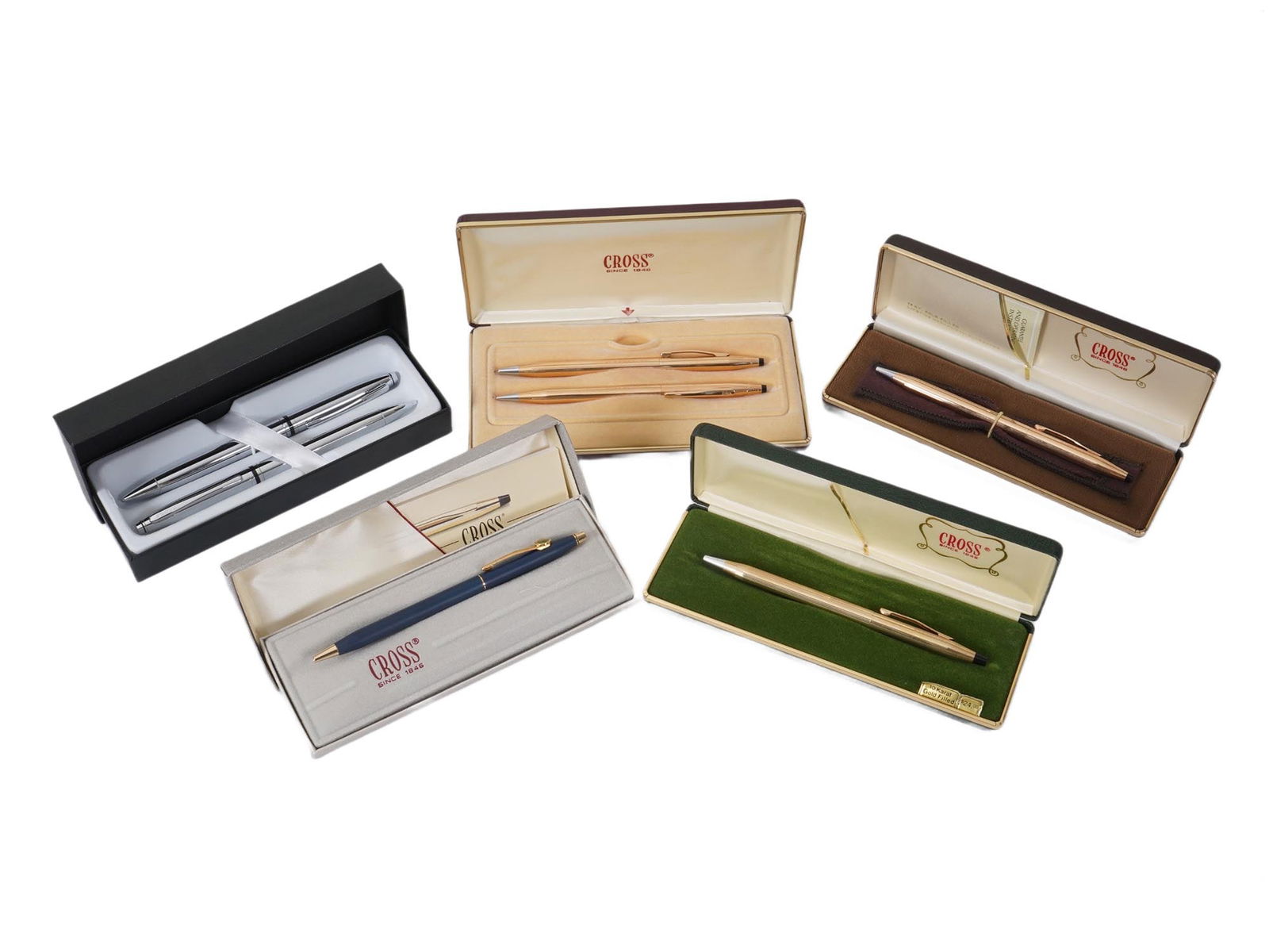 COLLECTION OF AMERICAN CROSS GOLD FILLED PENS IOB: A collection of vintage American Cross pens and pen sets. Most pens are ballpoint pens with a twist mechanism. Several models are made with a gold plating such as 10K Rolled Gold Filled over a brass b