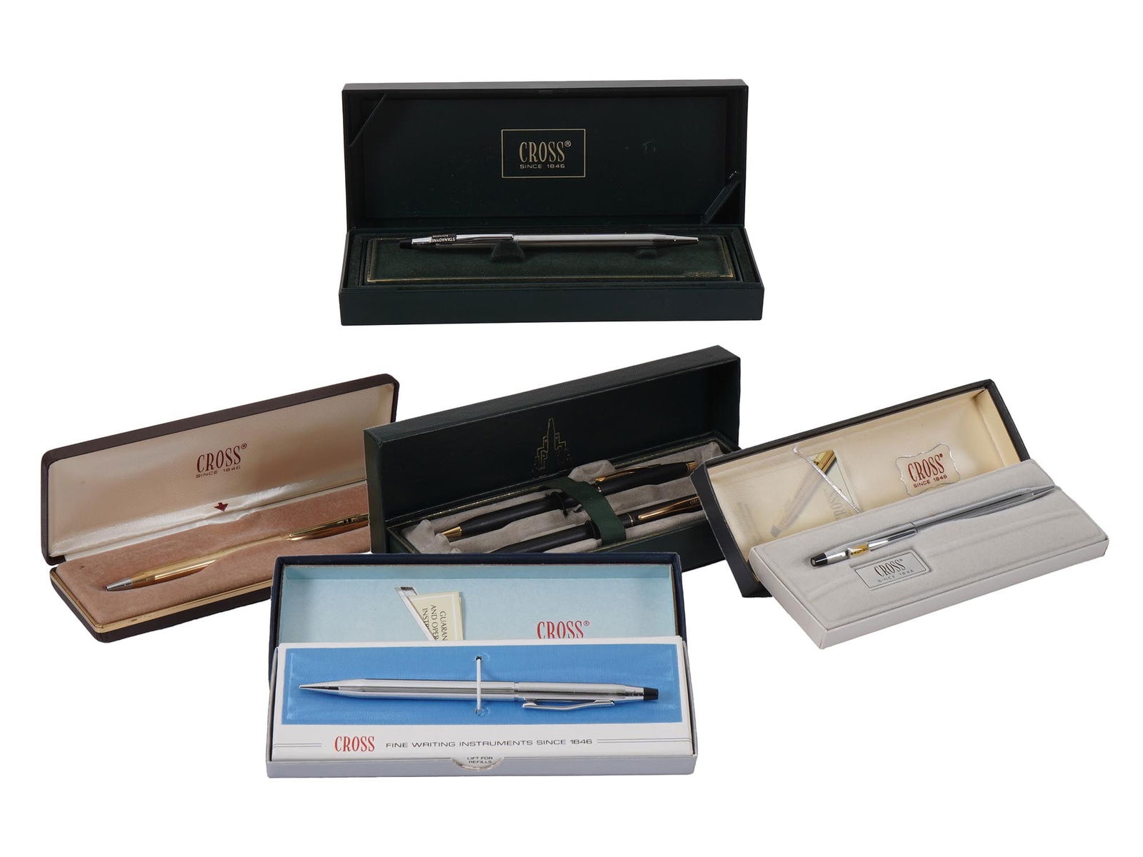 VINTAGE AMERICAN CROSS BALLPOINT PENS IN BOXES: A lot of 5 vintage American Cross ballpoint pens in boxes. The lot contains four Cross Classic Century stainless steel pens and Cross 2 items set. All items come in boxes. Collectible Pens And Writing