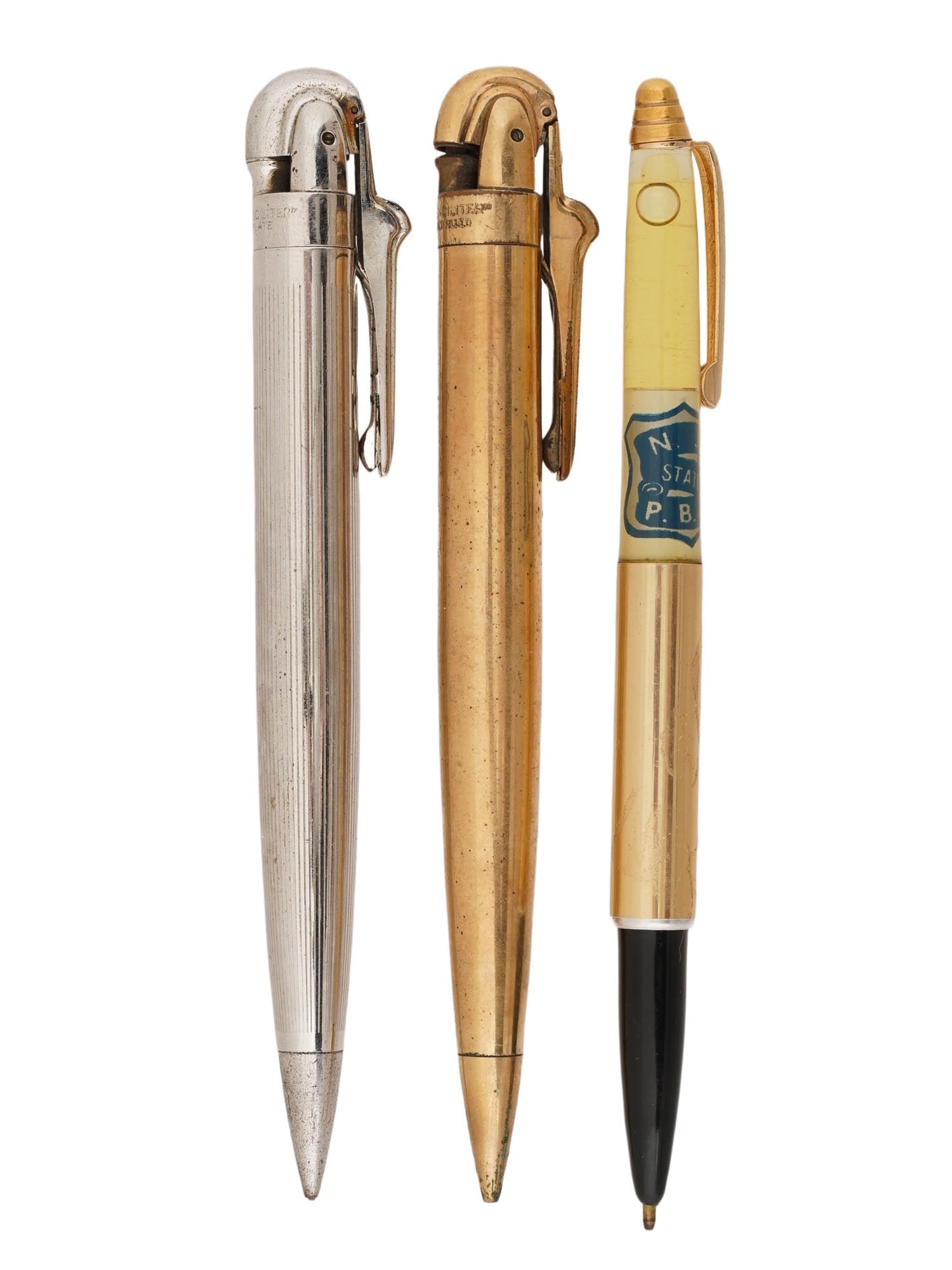 VINTAGE RONSON PENCILITERS AND FLOAT PEN: A group of three vintage writing instruments, two of which are multi-functional Penciliter models produced by the American brand Ronson starting in the 1940s. The first is a 14k gold filled. These ico