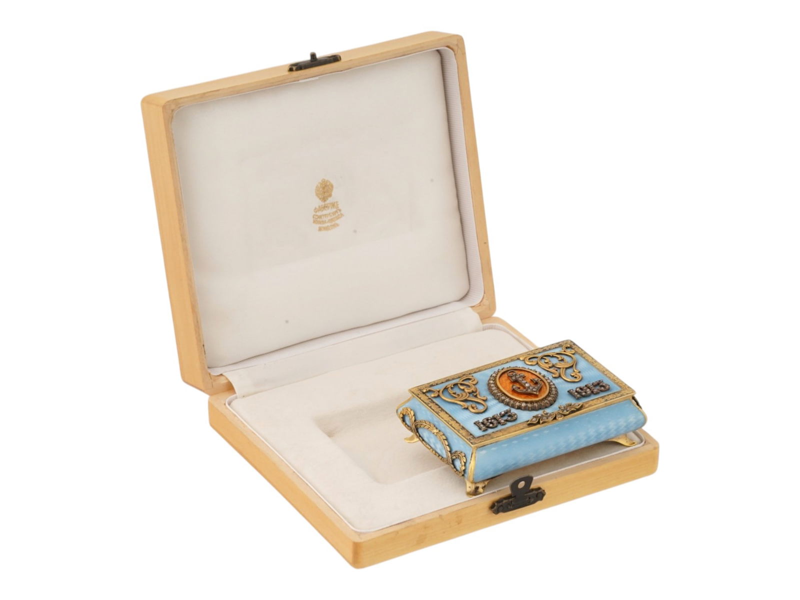 RUSSIAN IMPERIAL GILT SILVER ENAMEL PRESENTATION BOX: A Russian Imperial gilt silver presentation box, decorated with guilloche enamel. At the center of the lid is an oval plaque featuring a diamond-set anchor on a contrasting background, framed by
