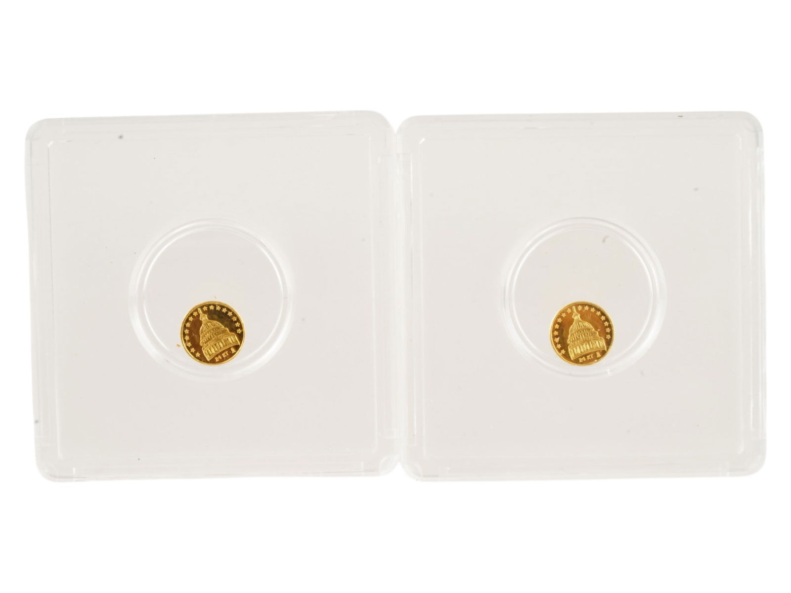 TWO US RONALD REAGAN 24K GOLD COMMEMORATIVE TOKENS: A lot of two American Ronald Reagan 24K gold commemorative tokens. The reverse features the U.S. Capitol Building in Washington, D.C., surrounded by 13 stars, representing the original 13 American