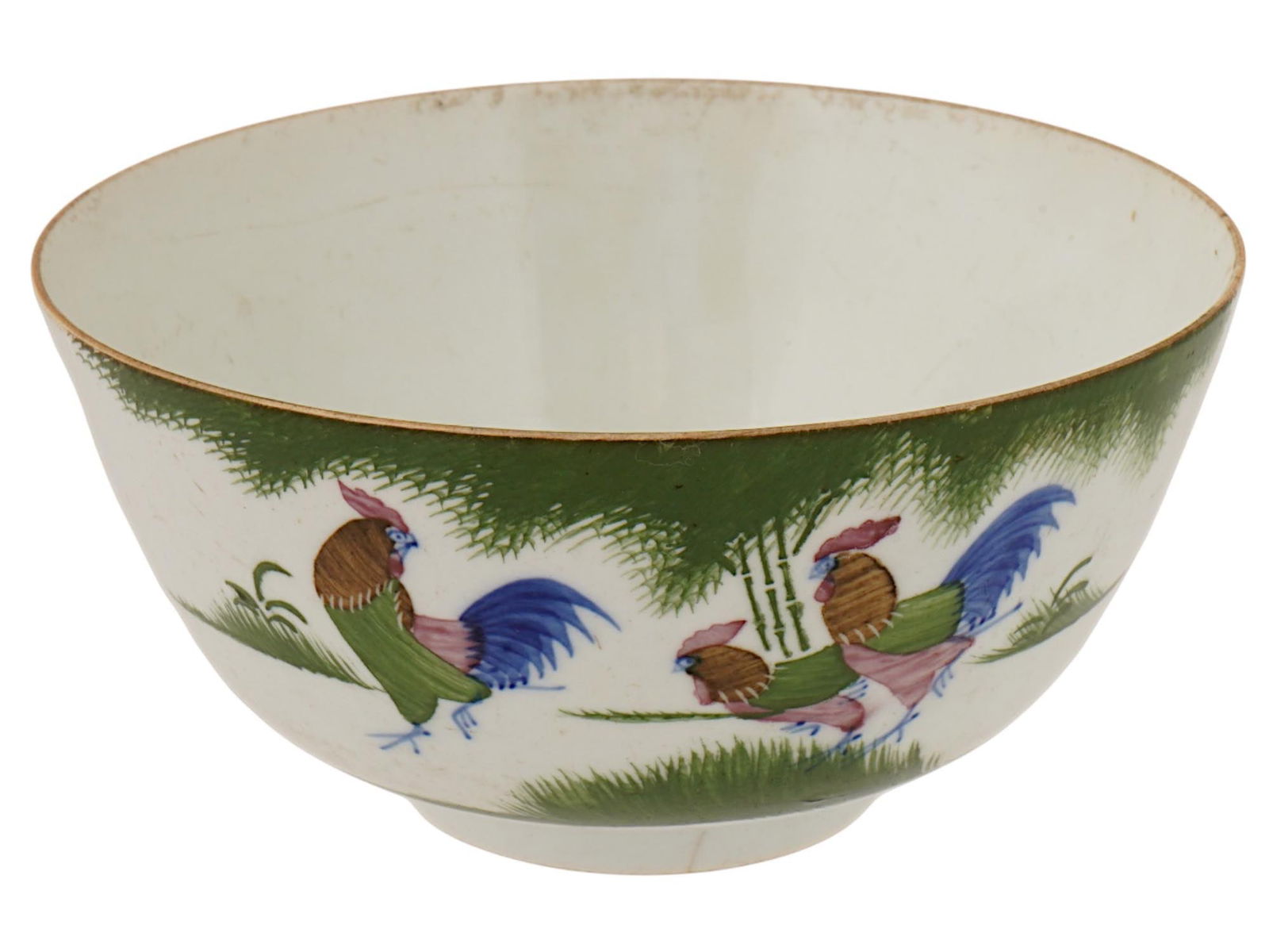 CHINESE WUCAI PORCELAIN HAND PAINTED COCKERELS BOWL: A Chinese hand painted porcelain bowl, decorated in the traditional wucai style. This bowl features depictions of cockerels in a garden setting. Wucai ware, a Chinese style of decorating white