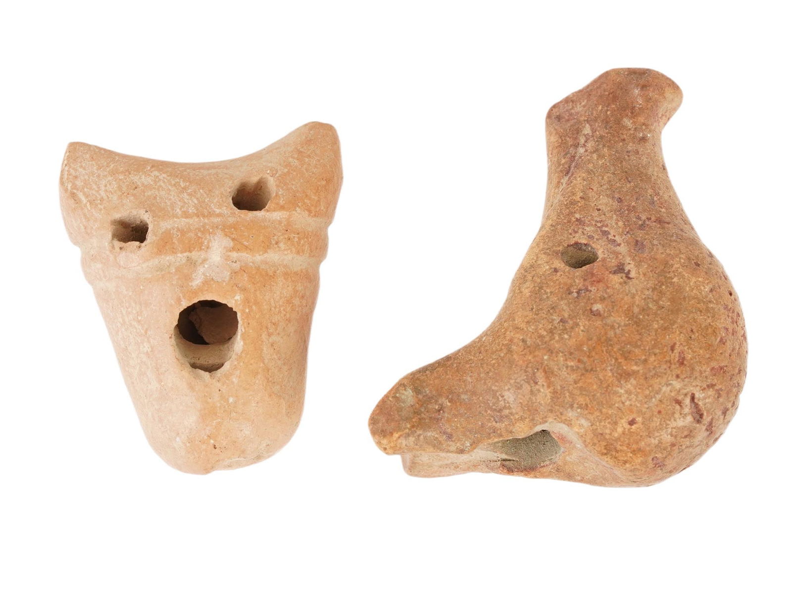 ANCIENT ROMAN TERRACOTTA WHISTLES 100 TO 300 AD: A lot of two ancient Roman terracotta pottery figural whistles. One whistle is made in a shape of a bird. The second whistle is made in a face design. Circa: 100 to 300 AD. Ancient Roman Terracotta