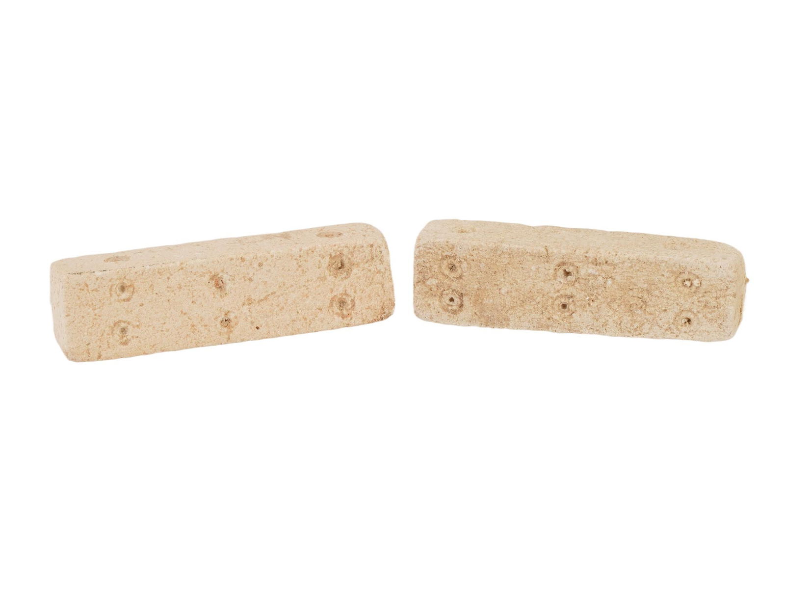 PAIR OF ANCIENT ROMAN ELONGATED STONE DICE 100 TO 300 AD: A pair of ancient Roman hand carved elongated stone dice, circa 100 to 300 AD. Carved from stone featuring an elongated design, these dice evoke the excitement and anticipation of games played by