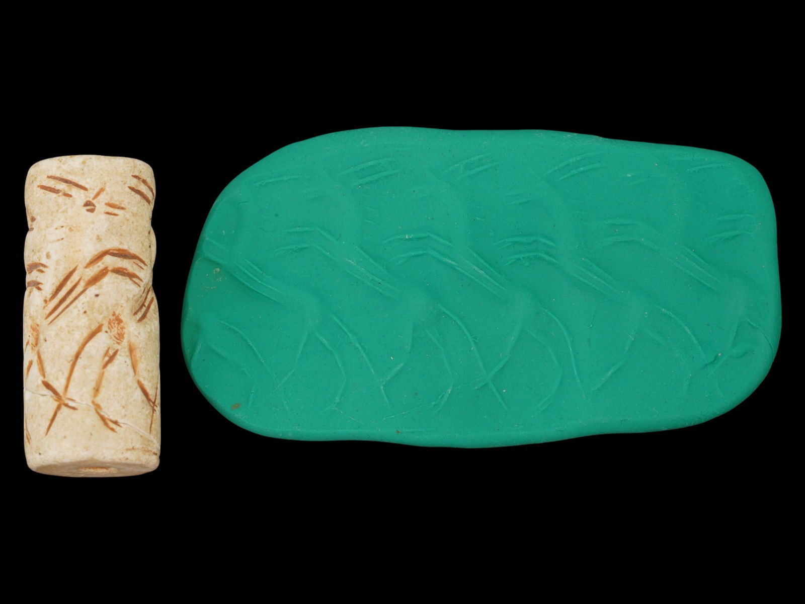 LARGE ANCIENT WESTERN ASIATIC STONE CYLINDER SEAL BEAD: A large ancient Western Asiatic carved stone cylinder seal bead engraved with an image featuring a group of animal figures. Repaired. Circa 1st millennium BC. Archaeological Finds And Relics, Ancient