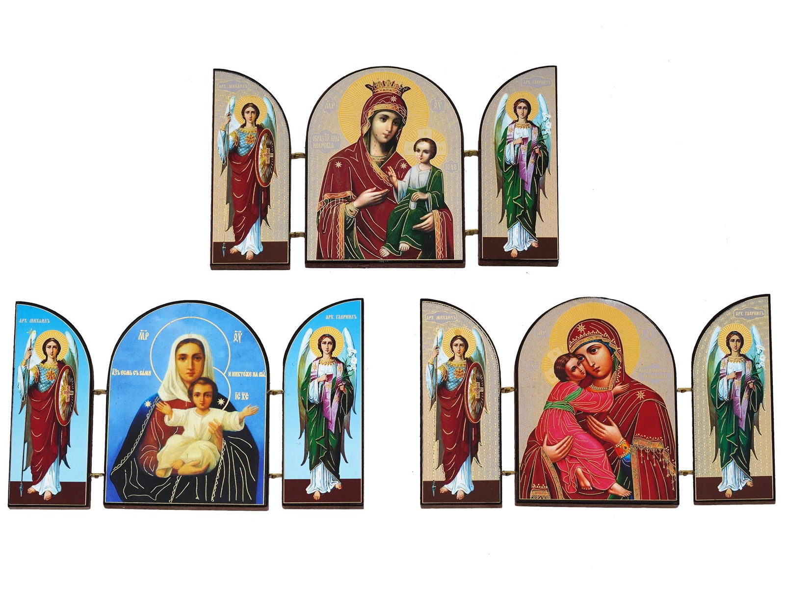 THREE ORTHODOX TRIPTYCH FOLDING SKLADEN ICONS: A lot of three orthodox triptych folding skladen icons. All icons are prints. The first skladen icon depicts the Iveron Icon of the Mother of God. The Mother of God is dressed in a red robe and is cro