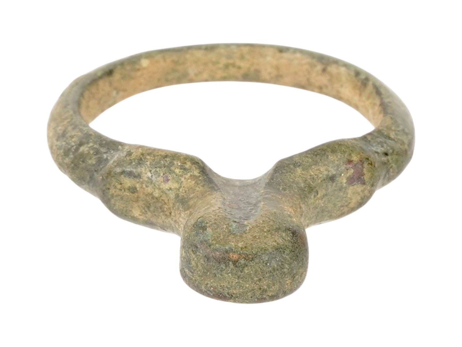 ANCIENT EARLY ROMAN CAST BRONZE EROTIC SIGNET RING: An Ancient Roman bronze signet ring. Late Republic to early Imperial era, ca. 100 BC to 100 AD. The ring features a classic signet-style construction with a prominent, flat-topped circular bezel. In a