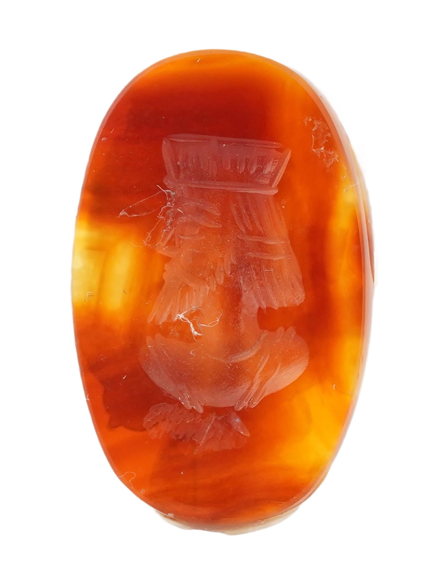 ANTIQUE VICTORIAN CARVED CARNELIAN INTAGLIO SEAL: An antique Victorian carved carnelian intaglio seal, oval in form, depicting a crowned male portrait rendered in classical profile. Executed in the traditional intaglio technique, the design is engrav