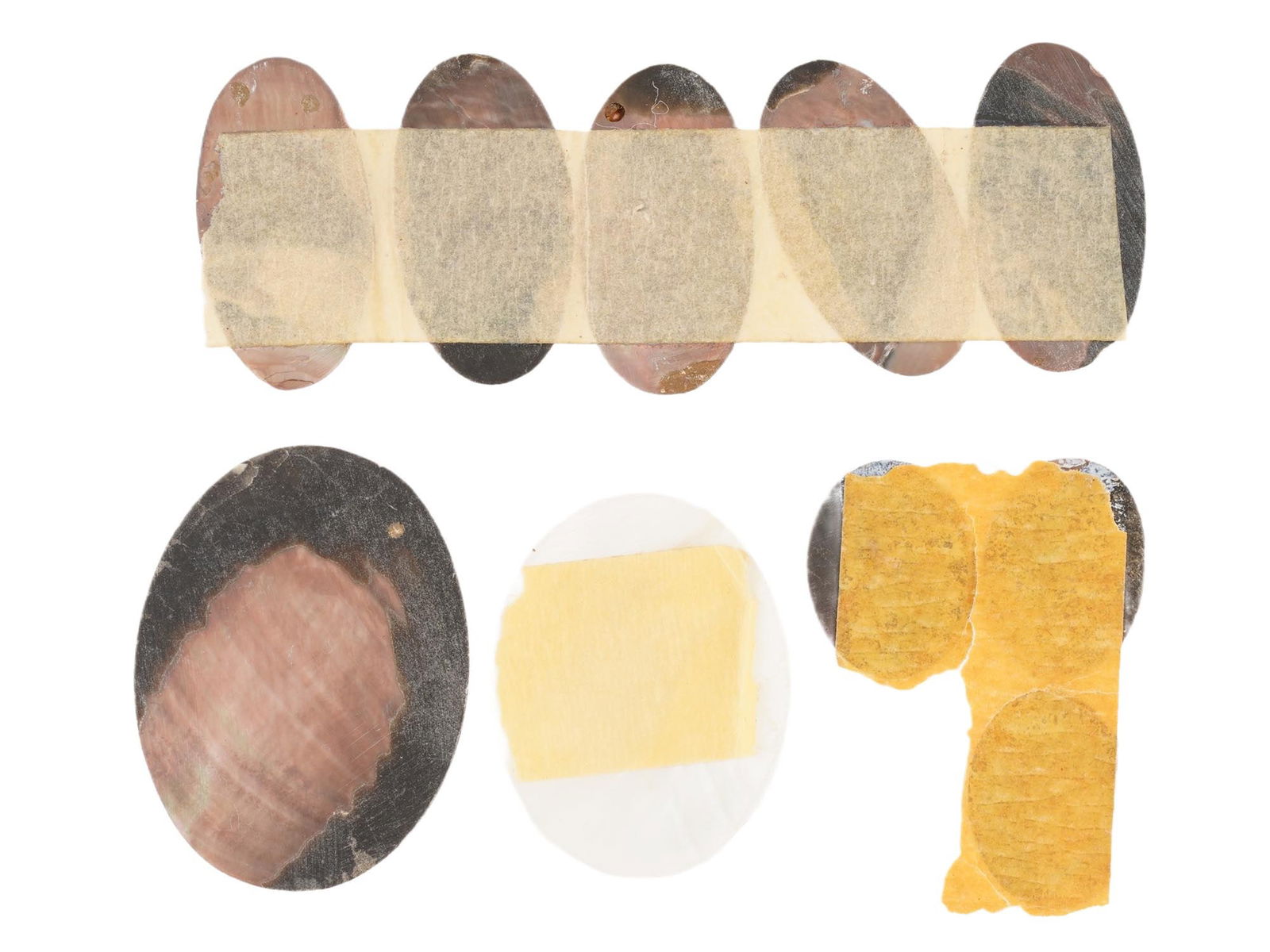 COLLECTION OF ANTIQUE HAND CARVED CAMEOS: A collection of 10 antique hand-carved cameos, dating to the early 20th century, each crafted from conch shell in the traditional oval form. The cameos depict female profile portraits in high relief,