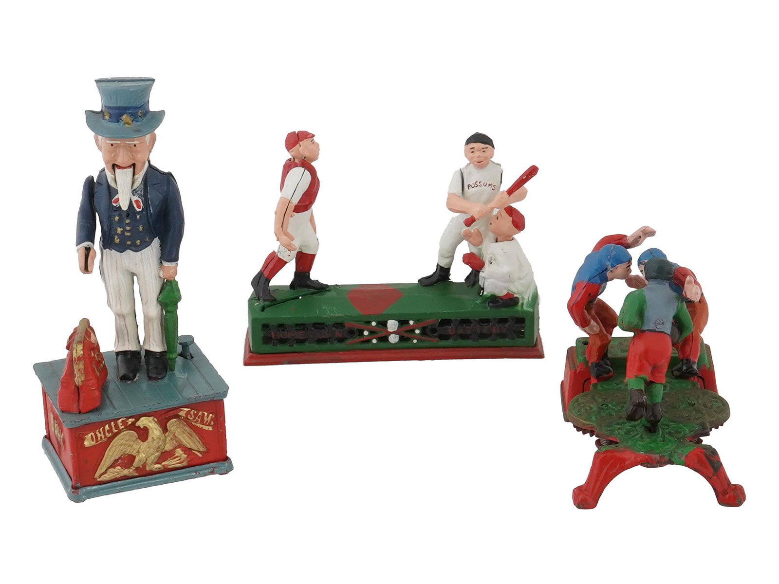 THREE VINTAGE IRON MECHANICAL COIN BANK TOYS: A group of three vintage iron mechanical bank toys: an Uncle Sam bank with an American eagle design, a Baseball Hometown Battery bank with figures depicting a game, and a football bank showing a group