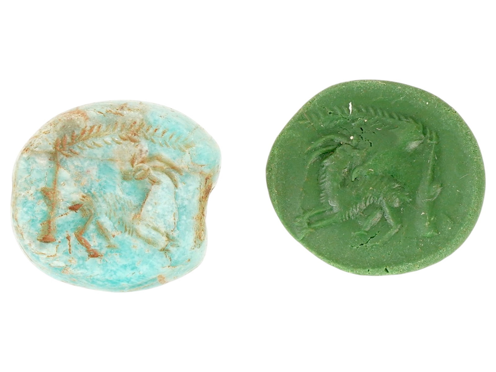 12- ANCIENT HOLY LAND TURQUOISE STAMP SEAL W ENGRAVED IMAGE OF PALM TREE AND A DEER 1000-700 BC: An ancient Holy Land carved Turquoise stone stamp seal. The circular shaped seal is adorned with an engraved image representing a deer and a palm tree. Circa: 1000 to 700 BC. Ancient Carved Natural St