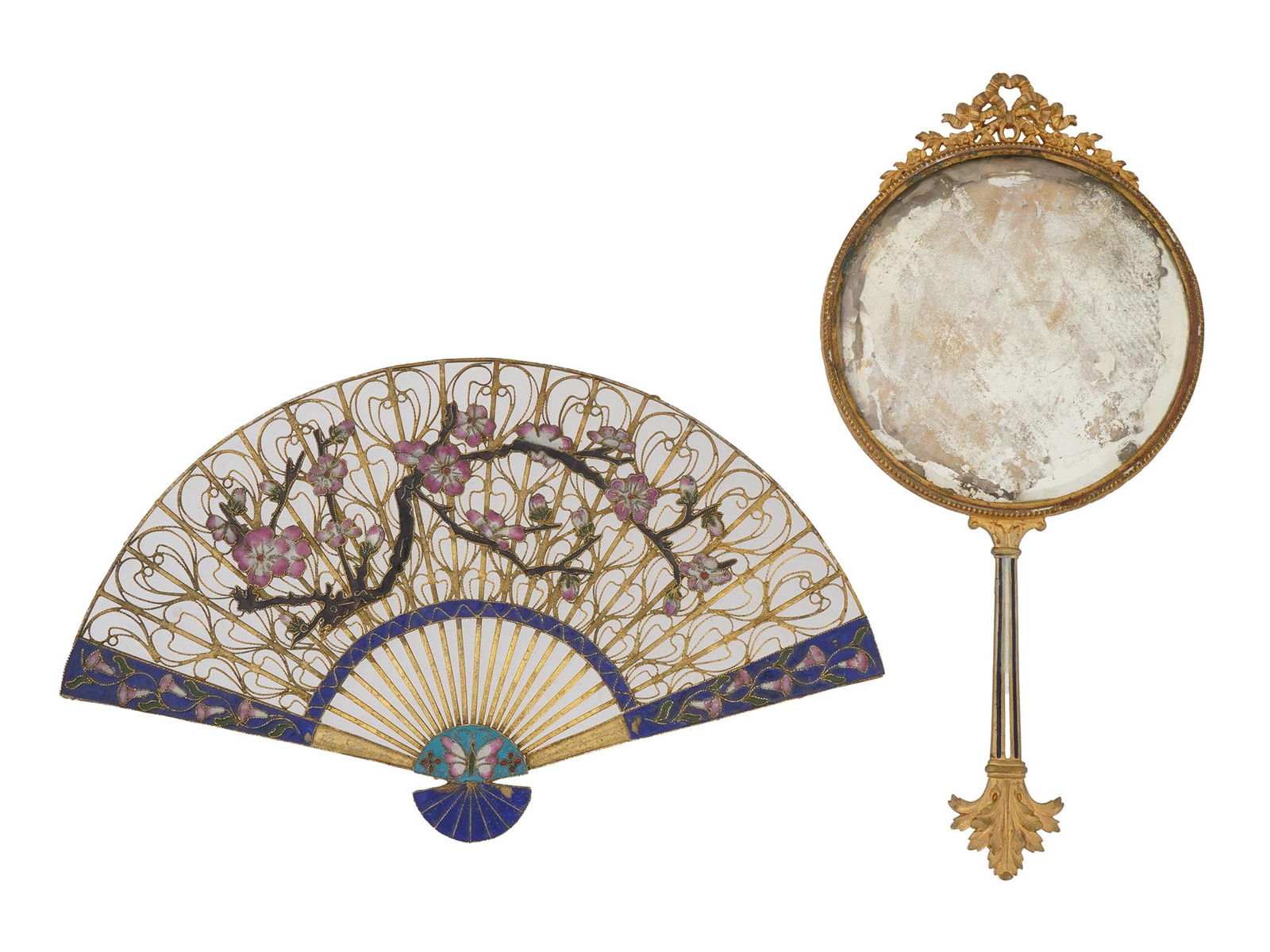 ANTIQUE FRENCH HAND MIRROR AND A DECORATIVE CHINESE FAN: An antique French hand mirror and a decorative Chinese fan. The hand mirror has a circular mirror with a gold-colored frame and handle decorated with foliage design. The mirror is adorned with a relie
