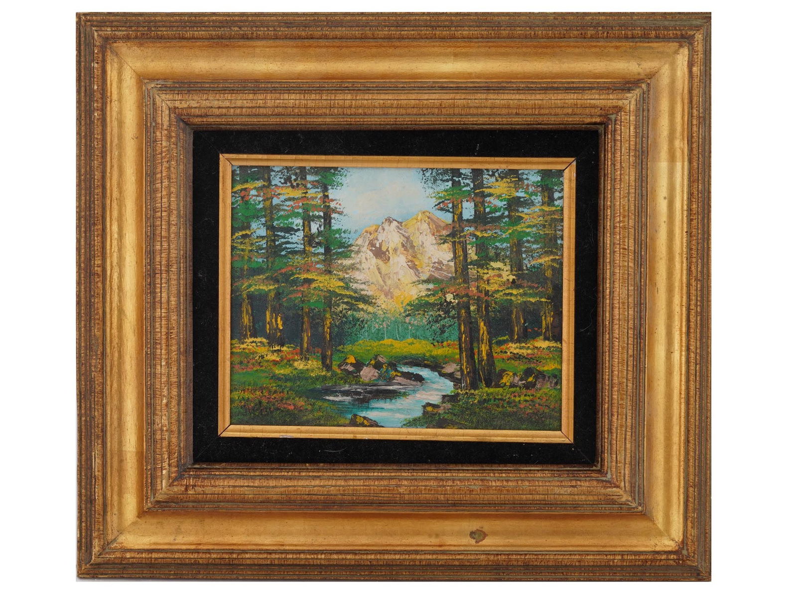 SIGNED T MORAN VINTAGE AMERICAN SCHOOL PAINTING: A vintage American school mixed media on canvas painting signed T. Moran. Circa the late 20th century. The artwork depicts a forest landscape with mountains in the distance. Framed. Signed T. Moran on