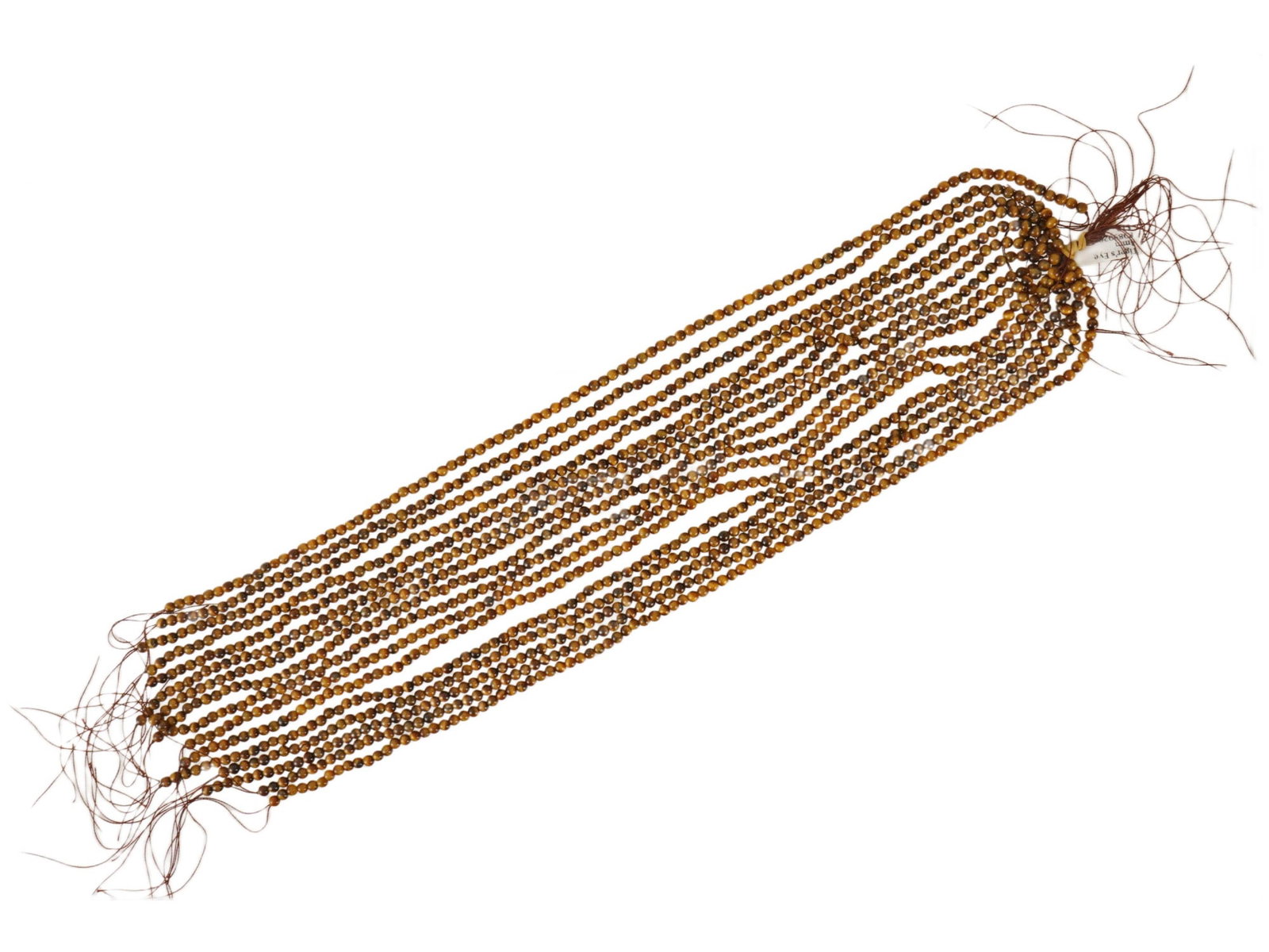 LOT OF 16 STRANDS OF ROUND NATURAL TIGERS EYE BEADS: A collection of 16 strands of round shaped natural tigers eye stone beads. They exhibit warm, earthy tones ranging from gold to deep brown. These are typical craft supplies used for making custom jewe
