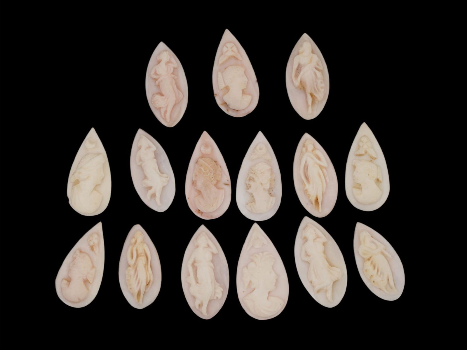 ANTIQUE VICTORIAN HAND CARVED SHELL CAMEO COLLECTION: A collection of 15 antique Victorian hand-carved shell cameos, traditional Italian works of relief sculpture carved from layered conch or helmet shell. The group features a variety of designs, most co