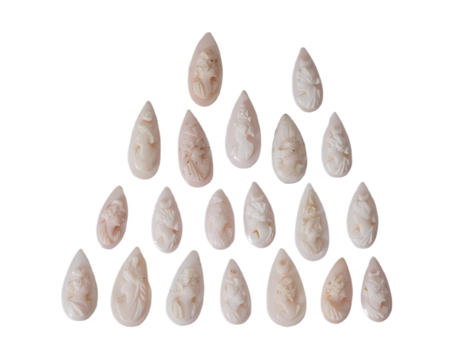 VTG CARVED CONCH SHELL CAMEOS TEARDROP FEMALE PROFILES: A set of twenty hand-carved conch shell cameos, presented as loose jewelry components ready for mounting. Each cameo is crafted in the traditional relief-carving technique, utilizing the natural pink