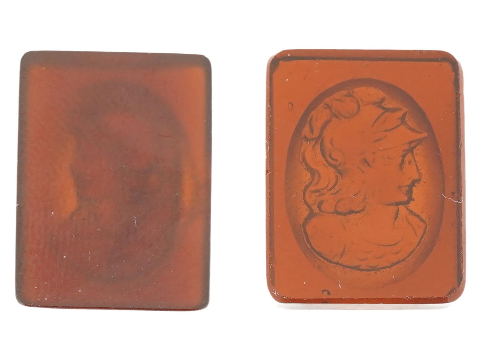PAIR OF VINTAGE HAND CARVED CARNELIAN CAMEOS: A pair of vintage hand-carved carnelian cameos of rectangular shape. Roman soldier profile portraits. Collectible Gemstone Carvings, Sculpture, Glyptic Art, Jewelry. THIS LOT IS ELIGIBLE FOR A