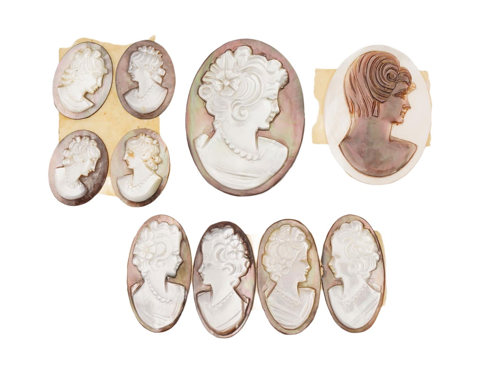 COLLECTION OF 10 CARVED SHELL CAMEO MEDALLIONS: A collection of 10 assorted vintage cameo medallions in various sizes. Each oval cut shell cameo depicts a relief female portrait in profile in the Victorian manner. Vintage Jewelry and Accessories, I