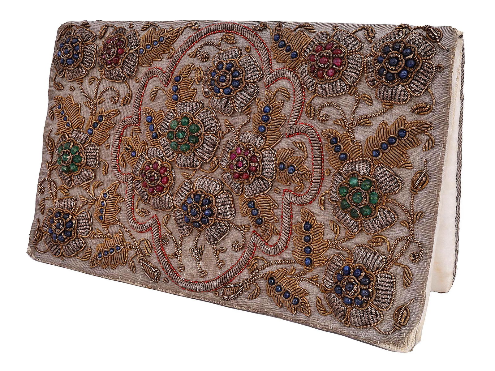 SILVER AND GOLD EMBROIDERED PURSE WITH GEMSTONES: A vintage textile clutch bag. The frontside of the purse is decorated with handmade embroidery. The silver and gold threaded floral pattern is garnished with blue and green sapphires and ruby gemstone