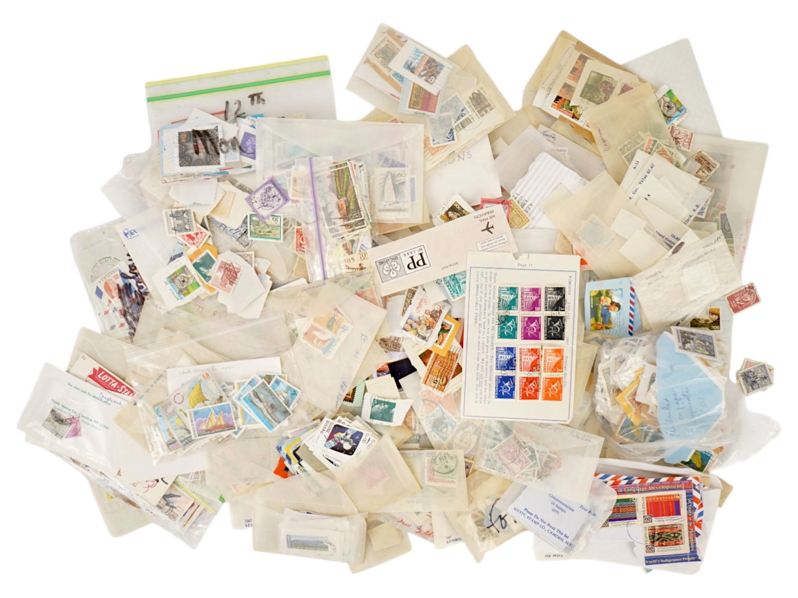 LARGE COLLECTION OF VINTAGE POSTAGE STAMPS: A large collection of vintage postage stamps covering a variety of topics. Stamps from various countries, partially sorted by region and date. Approximately mid to late 20th century. Vintage Postage S