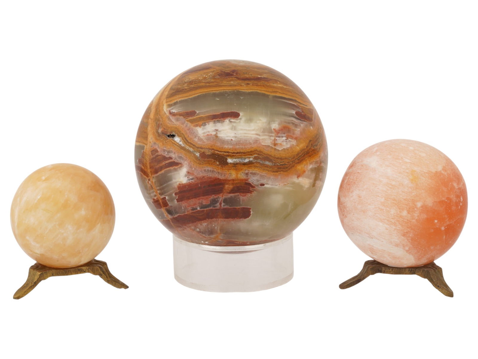 COLLECTION OF VARIOUS MINERAL STONE SPHERES W STANDS: A collection of three carved Mineral stones spheres. The spheres are presented in various sizes. Completed with a pair of footed stands, and a glass stand. Crystals and Mineral Stones, Decorative Obje