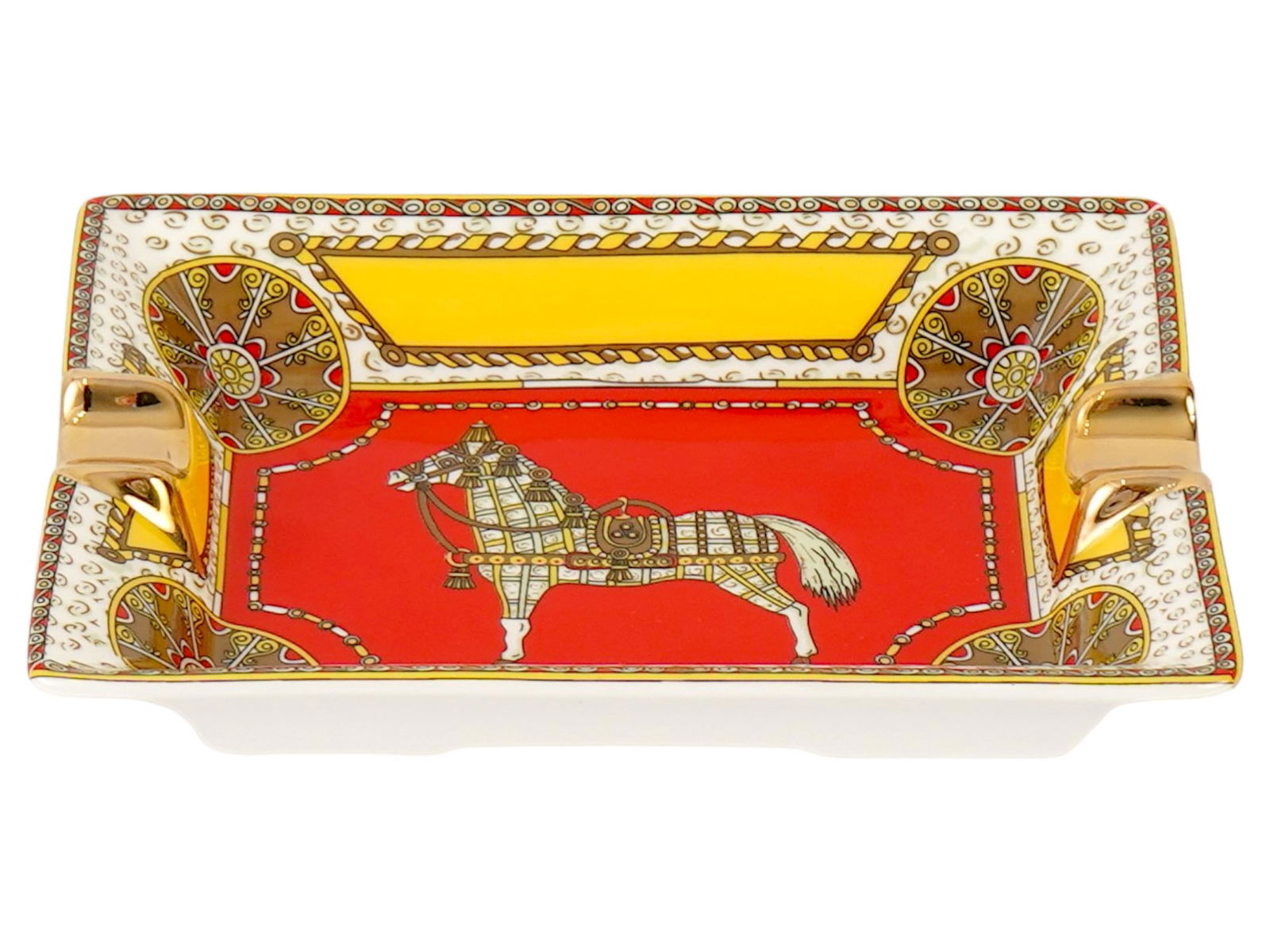 HERMES PARIS CHEVAL DORIENT PORCELAIN ASHTRAY: A porcelain ashtray by Hermes Paris from the Cheval dOrient collection. Rectangular piece with two gilt cigarette holders and transfer-printed oriental decoration in red featuring a horse in the cente